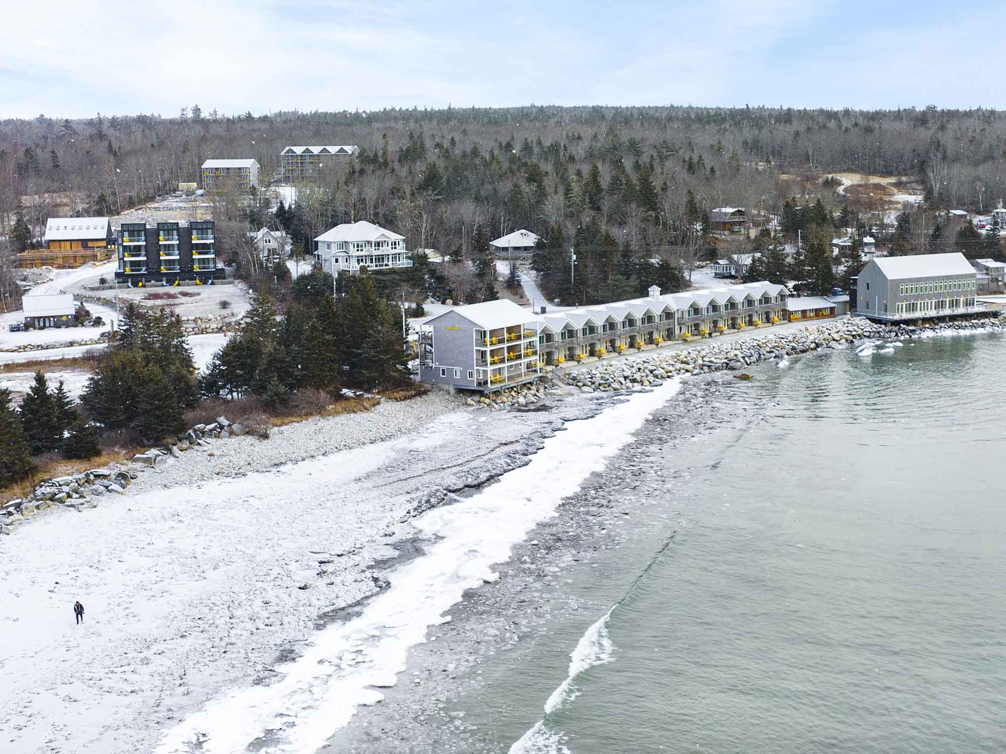 Drone view over the Quarterdeck resort property and Summerville Beach in the wintertime in Nova Scotia