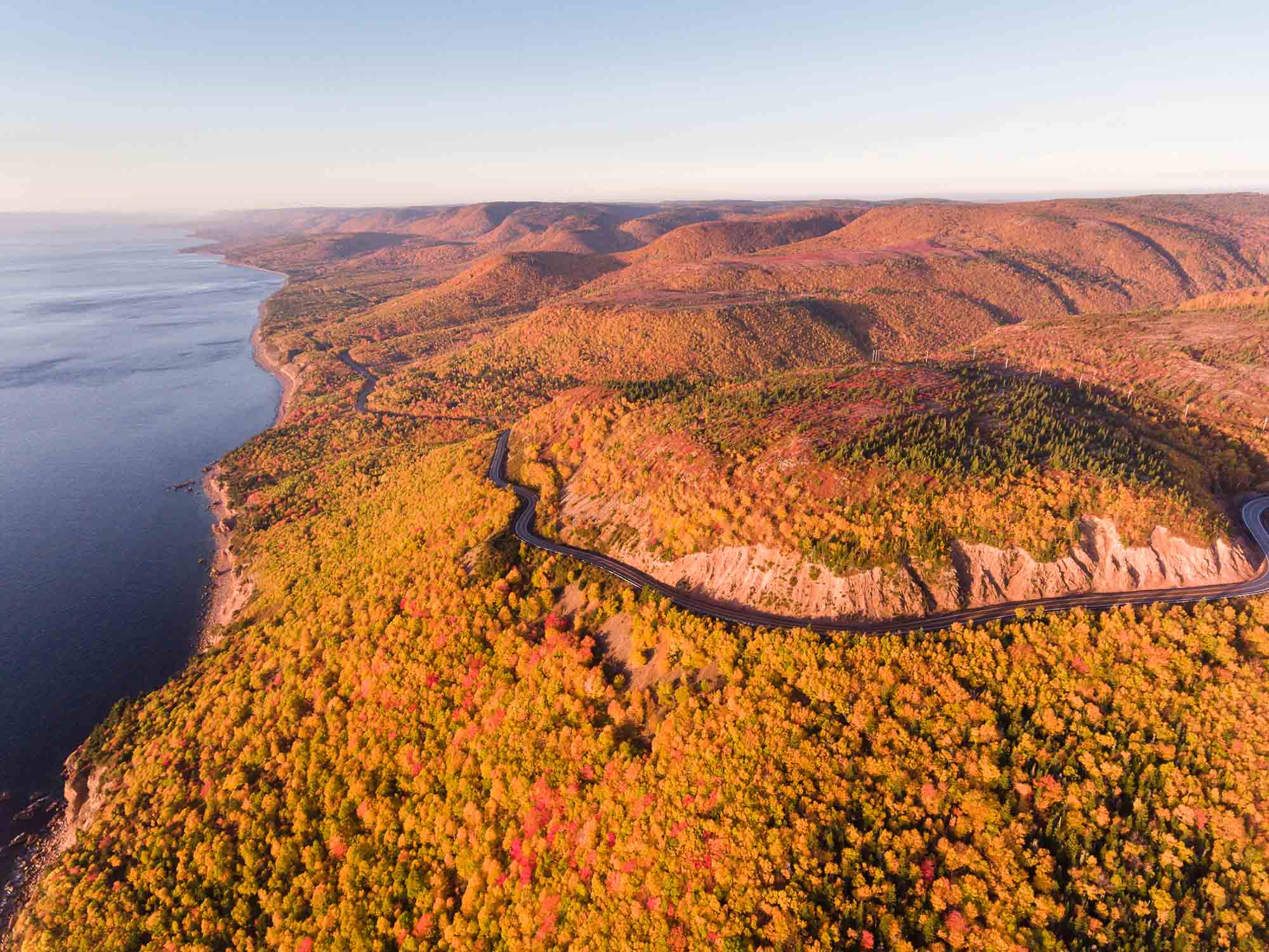 Autumn colours fill the Cape Breton Highlands mountain range in this photo of the Cabot Trail from a drone's view in Nova Scotia