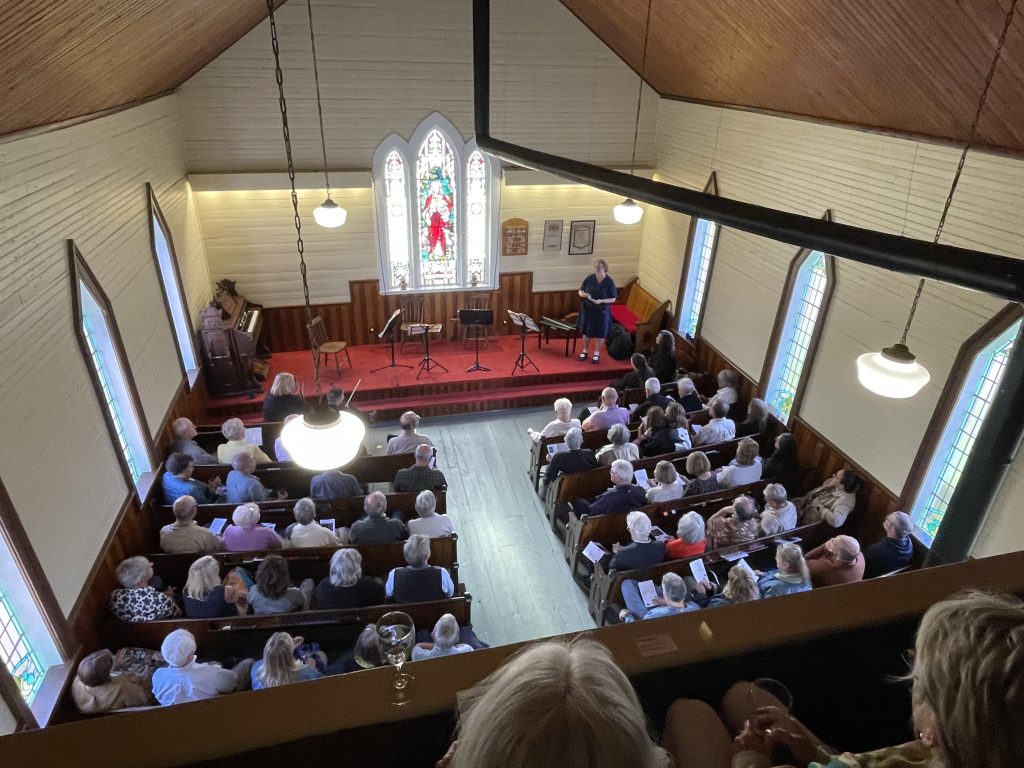 A n aerial view of the stage and full pews of spectators during the Musique Royale Concert at Memory Lane in Nova Scotia