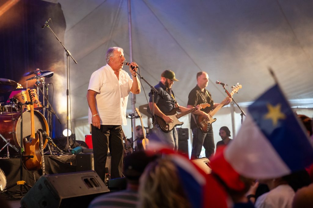 A band performs on stage during the Festival acadien de Clare in Nova Scotia
