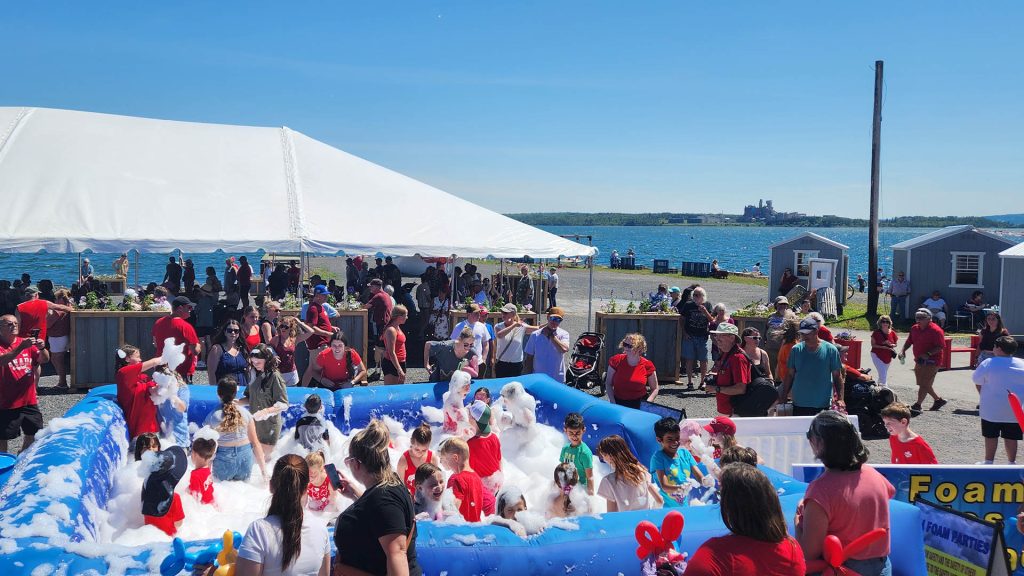 A group of children enjoy the foam pit at the Canada Day Celebrations at Pictou Waterfront in Nova Scotia