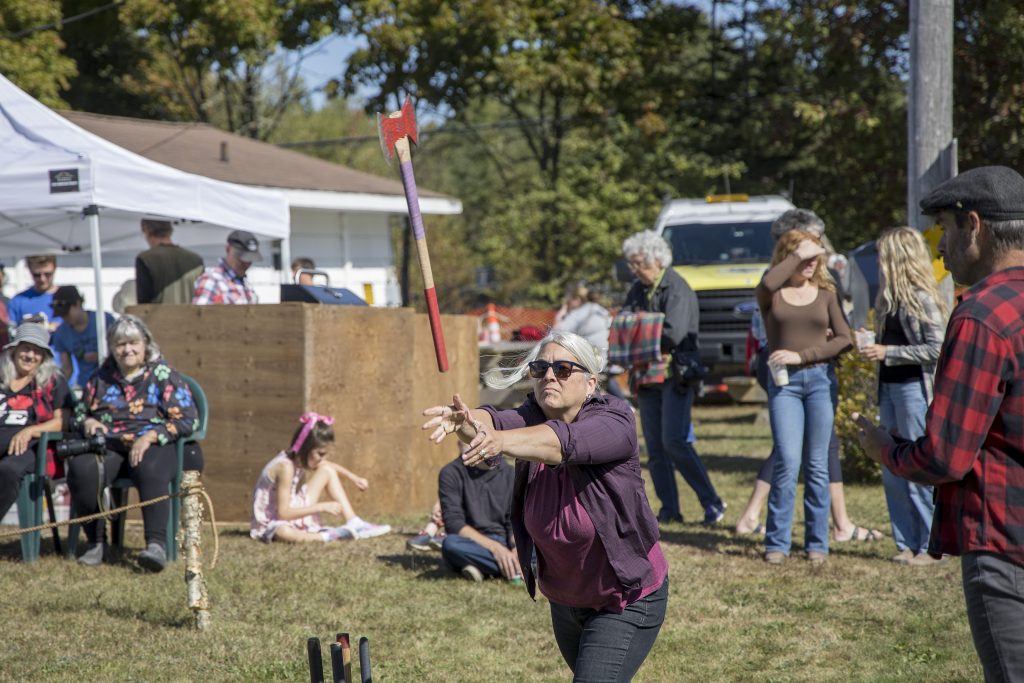 A woman throws an axe at the Nova Scotia Forest Festival at Memory Lane in Nova Scotia