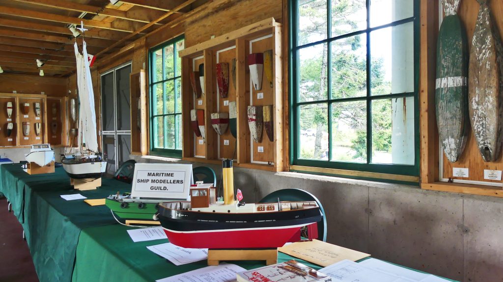 A wooden ship on a table during the Dominion Day “Old Time” Village Fair at Memory Lane in Nova Scotia
