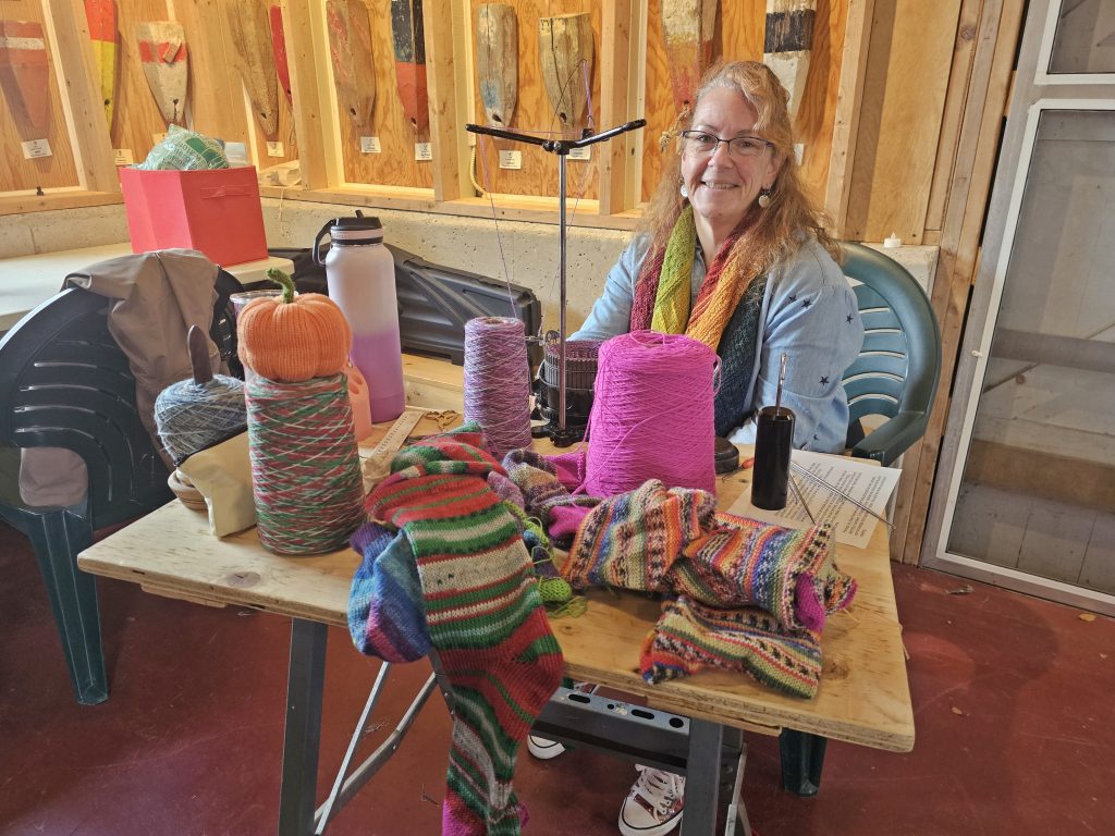 A lady sits a table