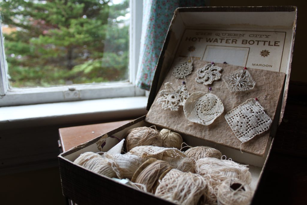 An open briefcase showcasing lace decorations at the Memory Lane Fibre Arts Festival in Nova Scotia
