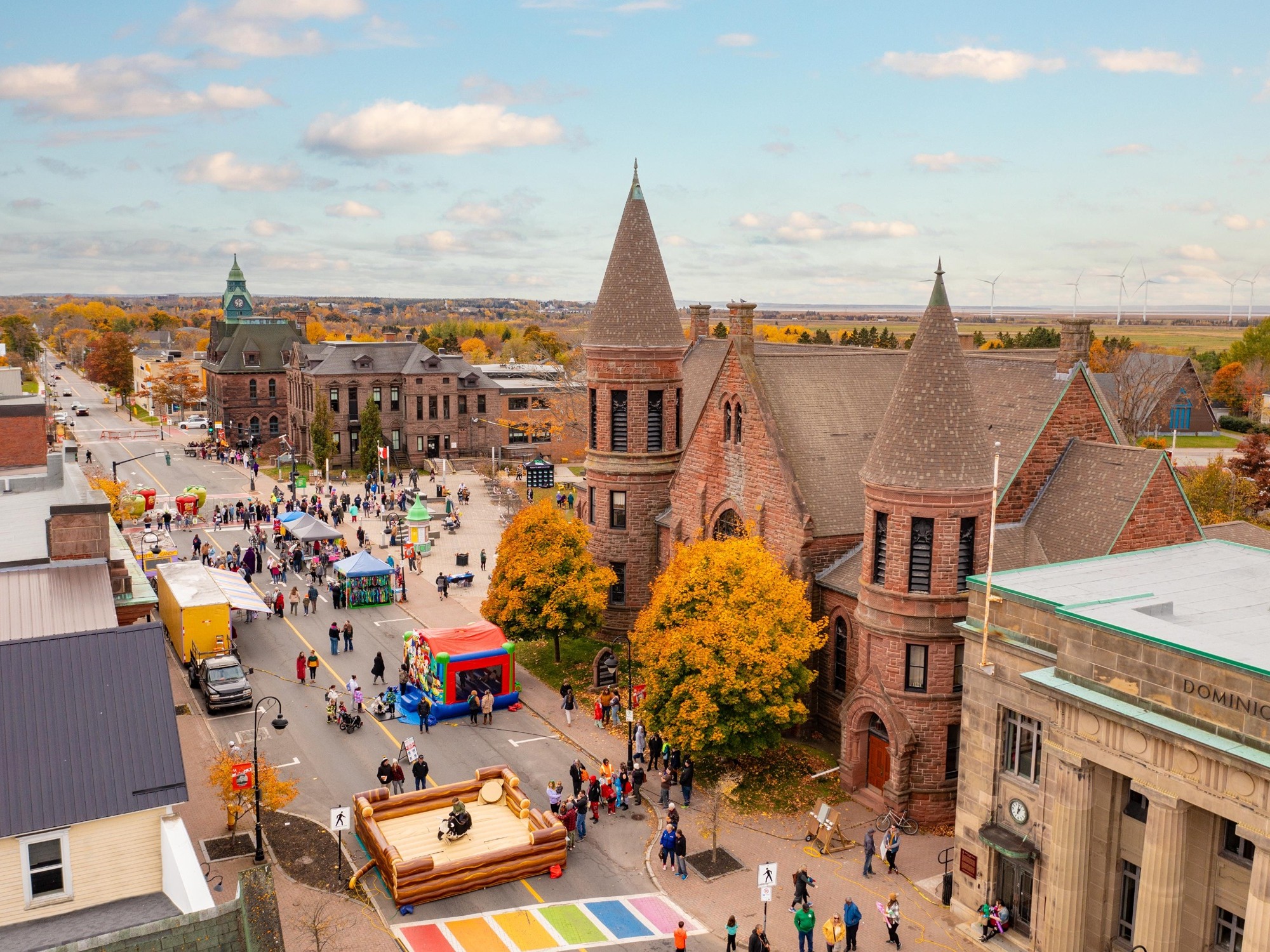 An aerial view of a street festival in Amherst, Nova Scotia durin fall