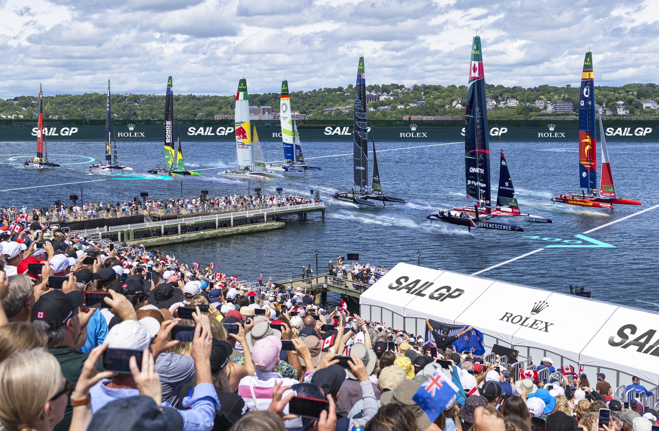 A bandstand full of spectators take in the Sail Grand Prix on the Halifax Harbour in Nova Scotia