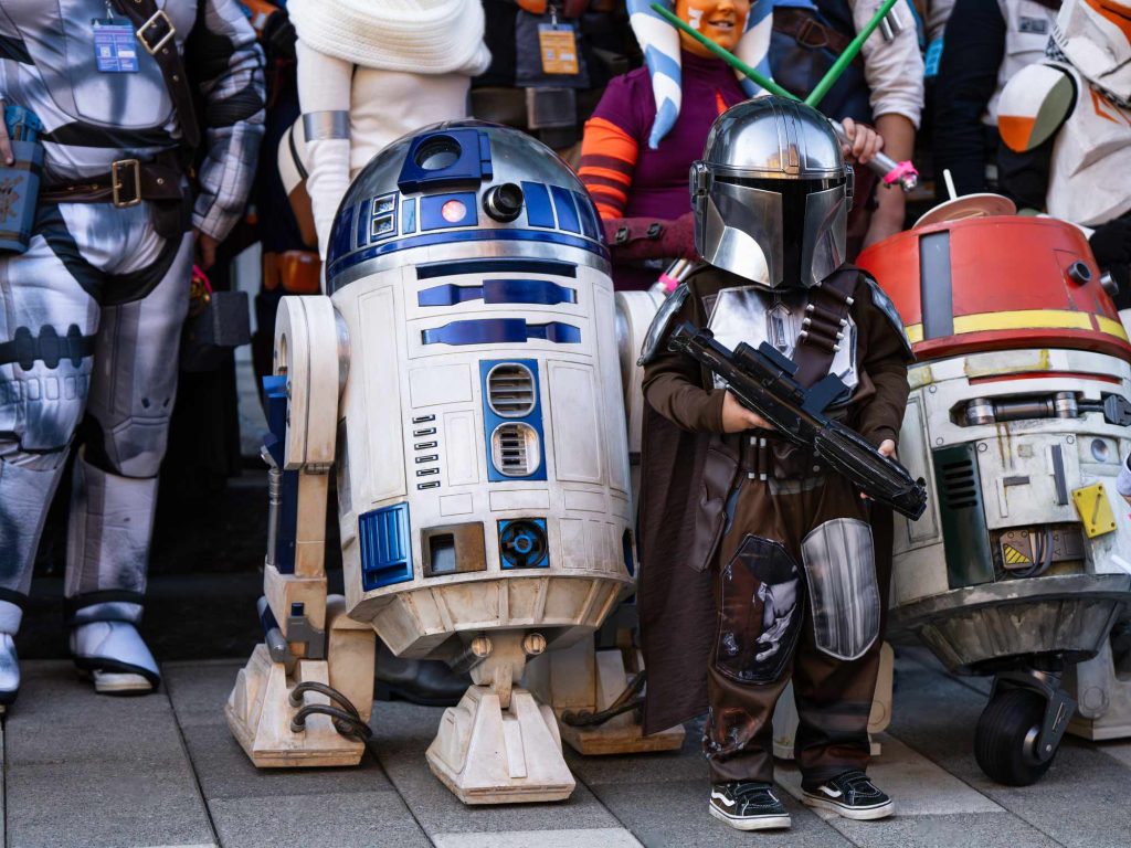 A costumed child posing with another child in an R2D2 Star Wars costume at Hal-Con in Halifax Nova Scotia