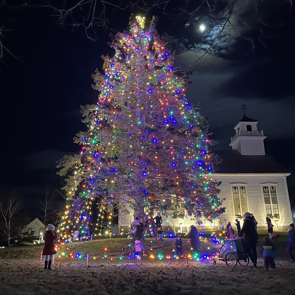A large tree all lit up for Christmas at Sherbrooke Village in Nova Scotia