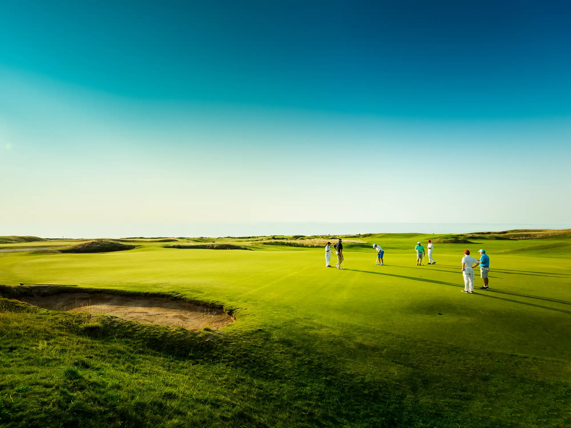 A group golfs at Cabot Links in Cape Breton