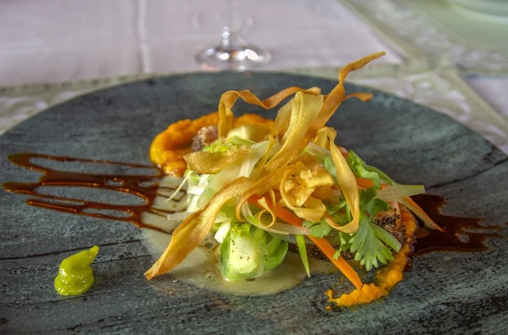 A close of view of an Atlantic Salmon plated dish at Fox Harb'r Spring Culinary Weekend in Nova Scotia