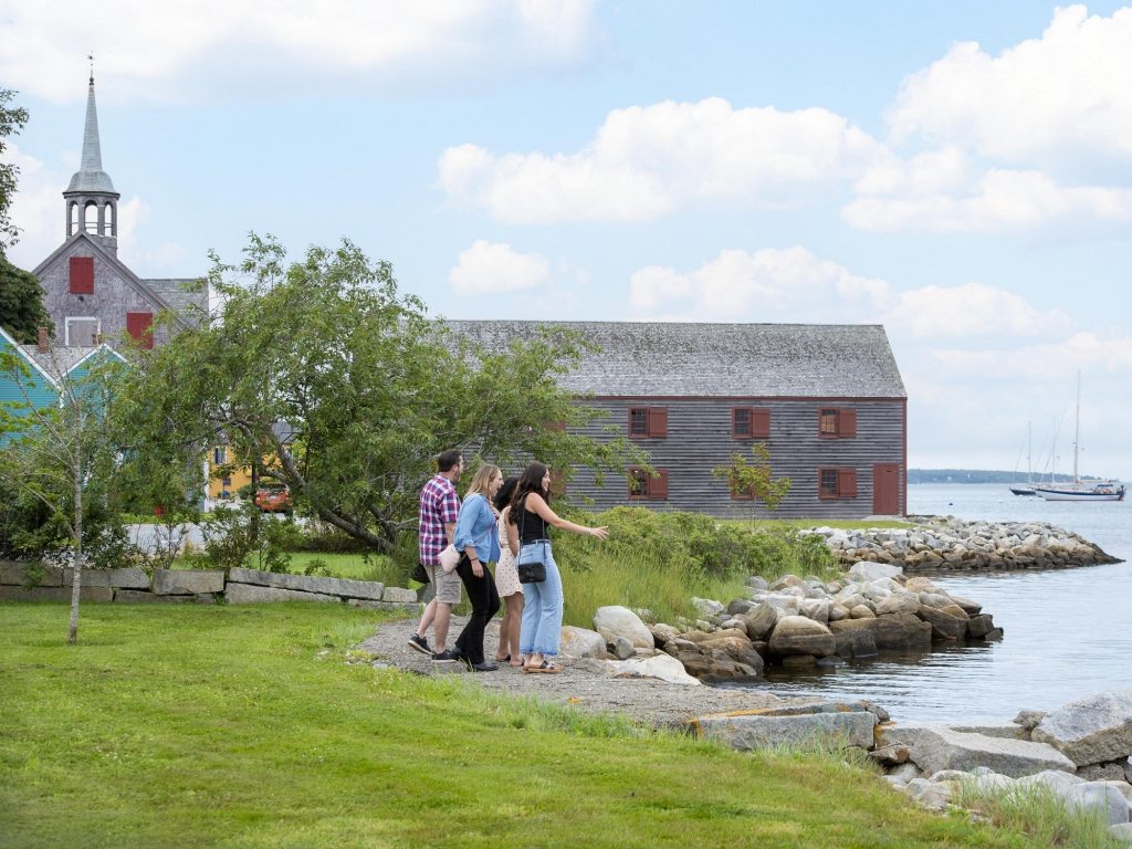 A group of friends checks out the waterfront area in the coastal community of Shelburne.