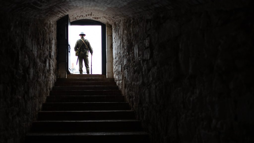 A solider stands in a doorway at the top of the stairs at Halifax Citadel National Historic Site in Nova Scotia