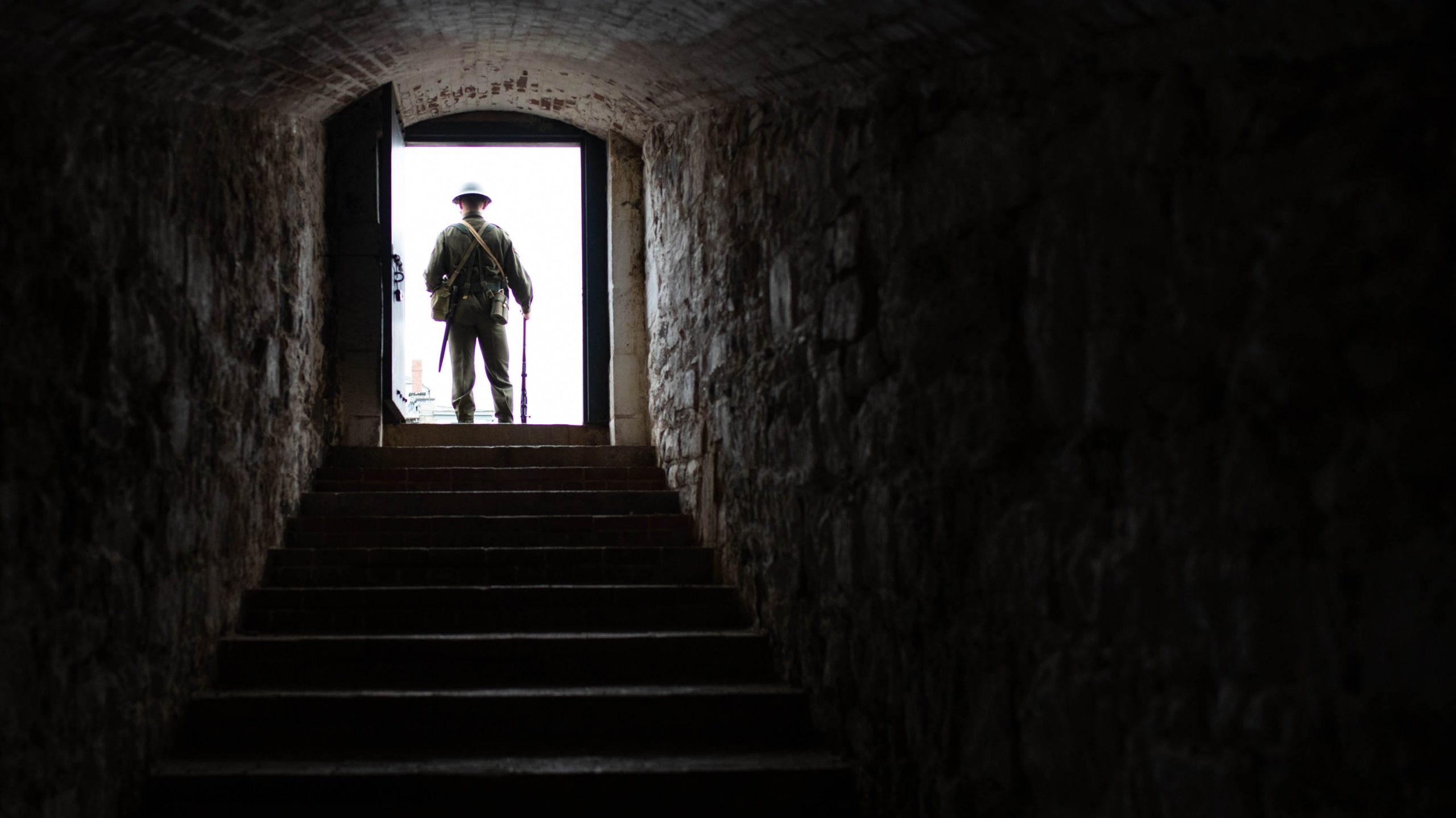 A solider stands in a doorway at the top of the stairs at Halifax Citadel National Historic Site in Nova Scotia