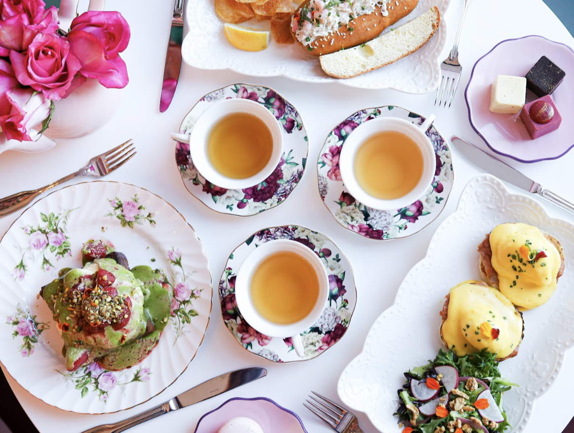 Tea and breakfast menu items on a table