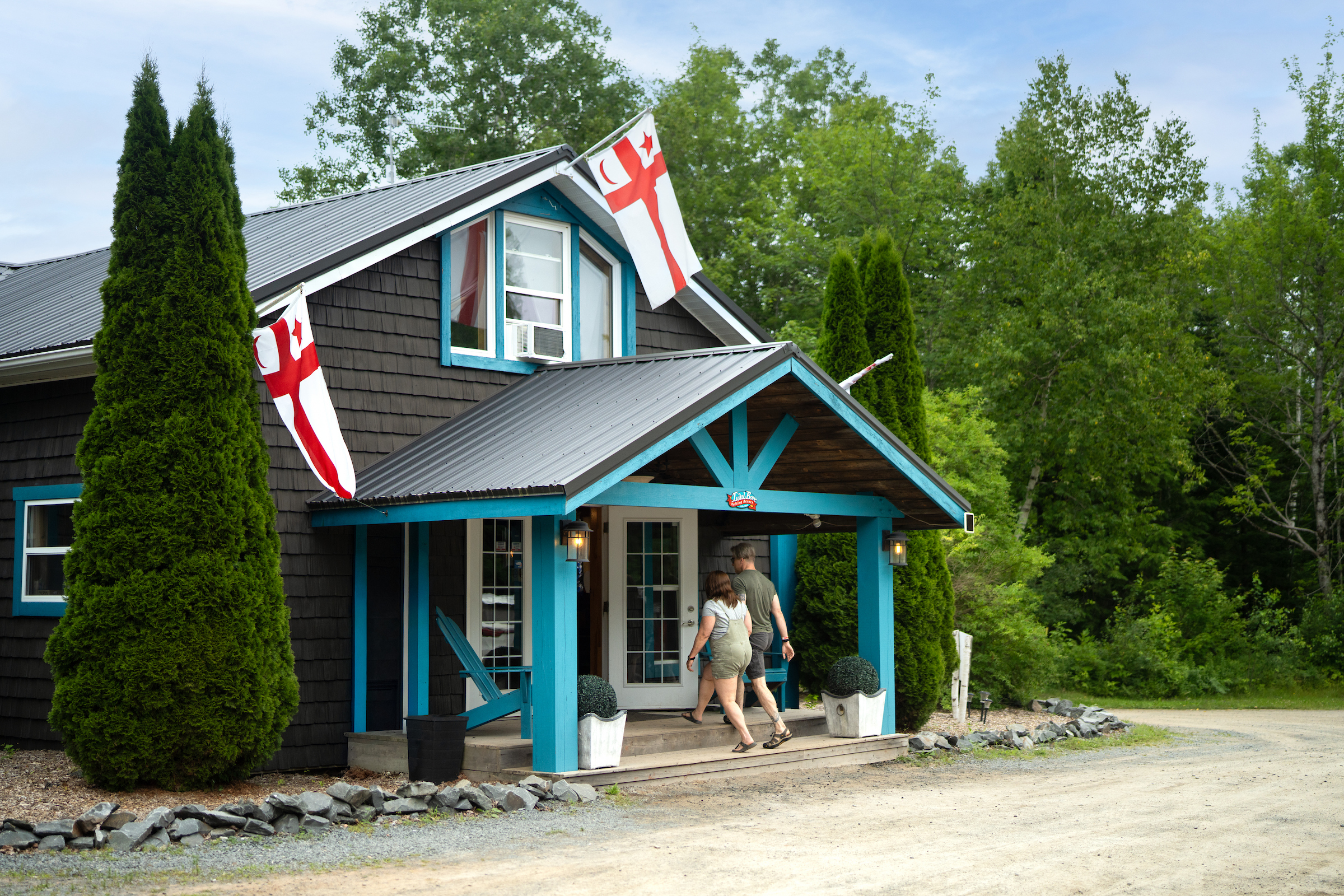 A couple walks toward the entrance of the Tidal Bore Rafting Resort main lodge