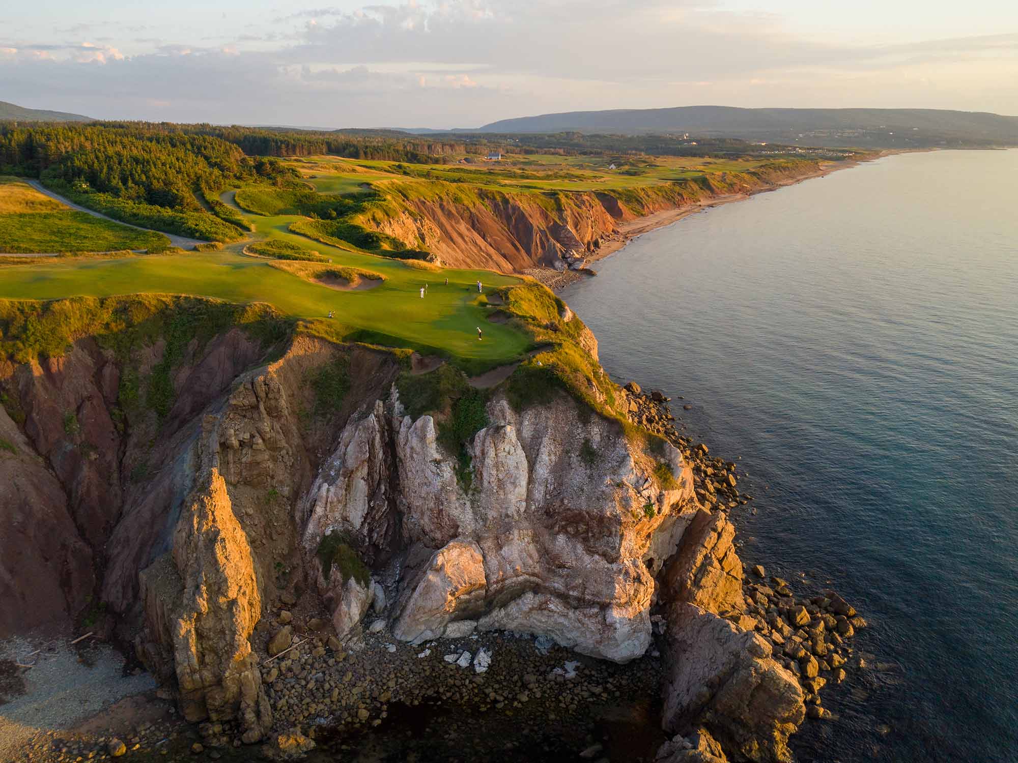 Drone view over Cabot Cape Breton's 16th hole near sunset at Cape Cape Breton in Nova Scotia