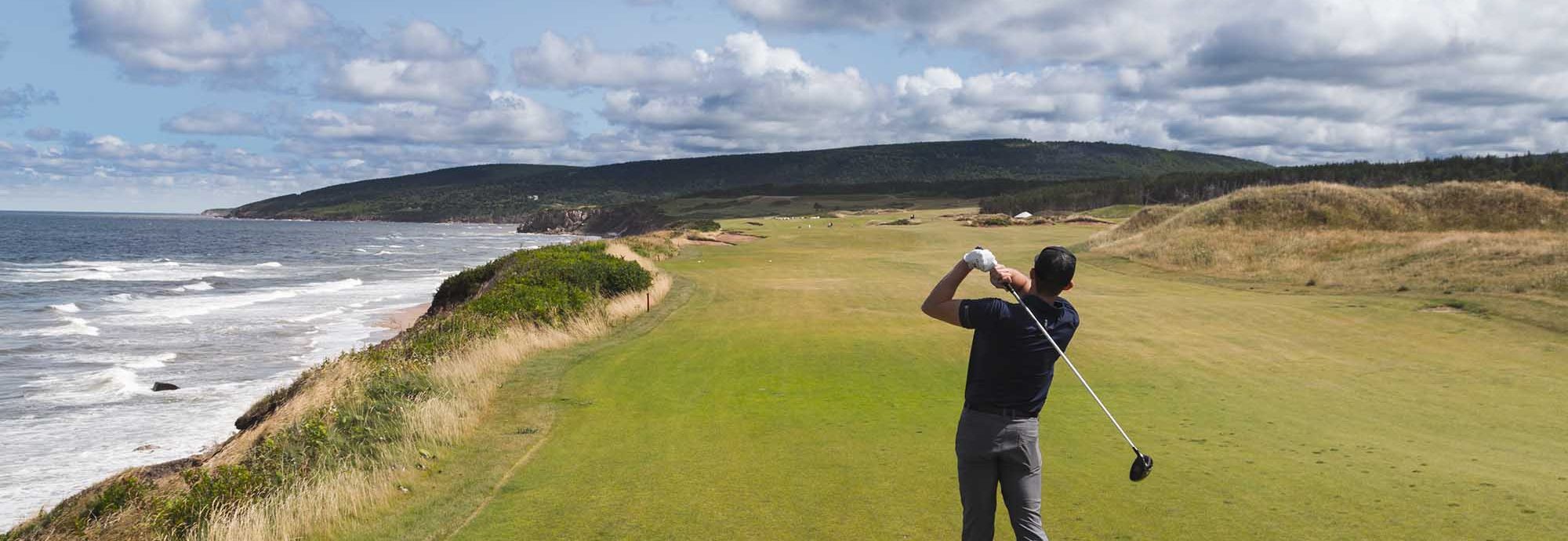 Golfer golfing at Cabot Links at Cabot Cape Breton in Inverness, Cape Breton Island, Nova Scotia