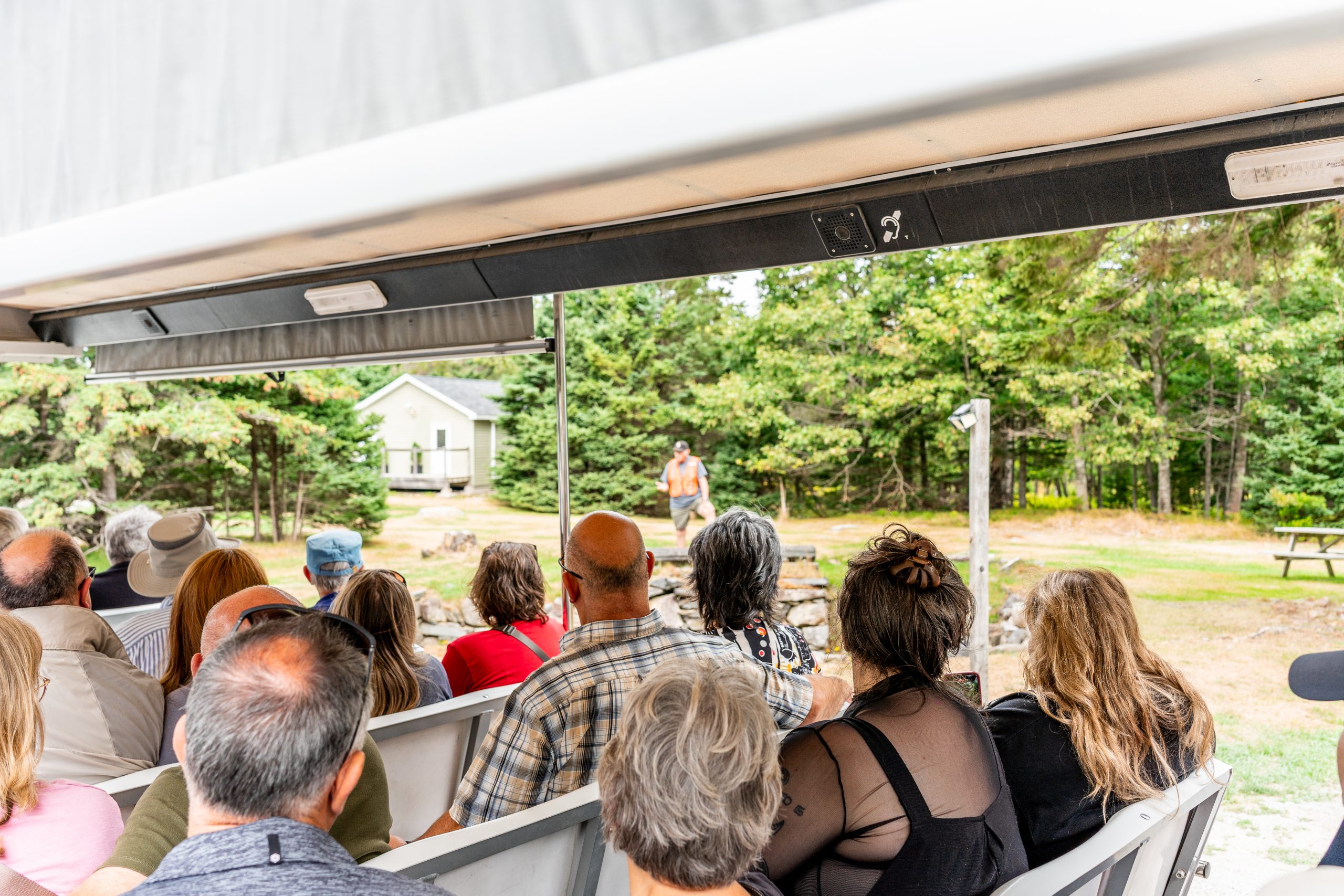 Tour participants viewing Oak Island from the Money Pit Express tram while on the guided Oak Island Tour in Nova Scotia.