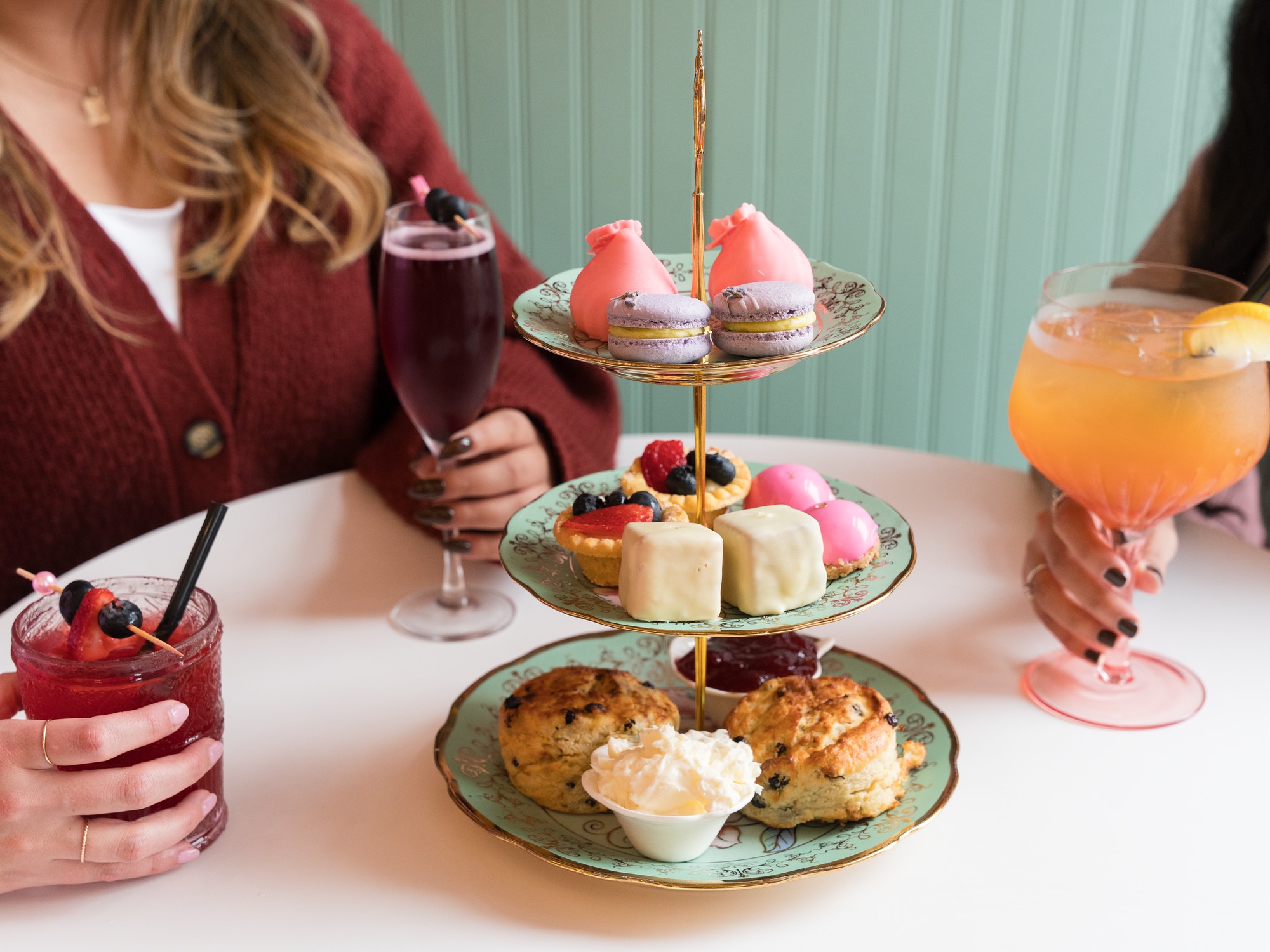 A tiered tray of brunch food with drinks on the table at Halifax, Nova Scotia restaurant, Creme.