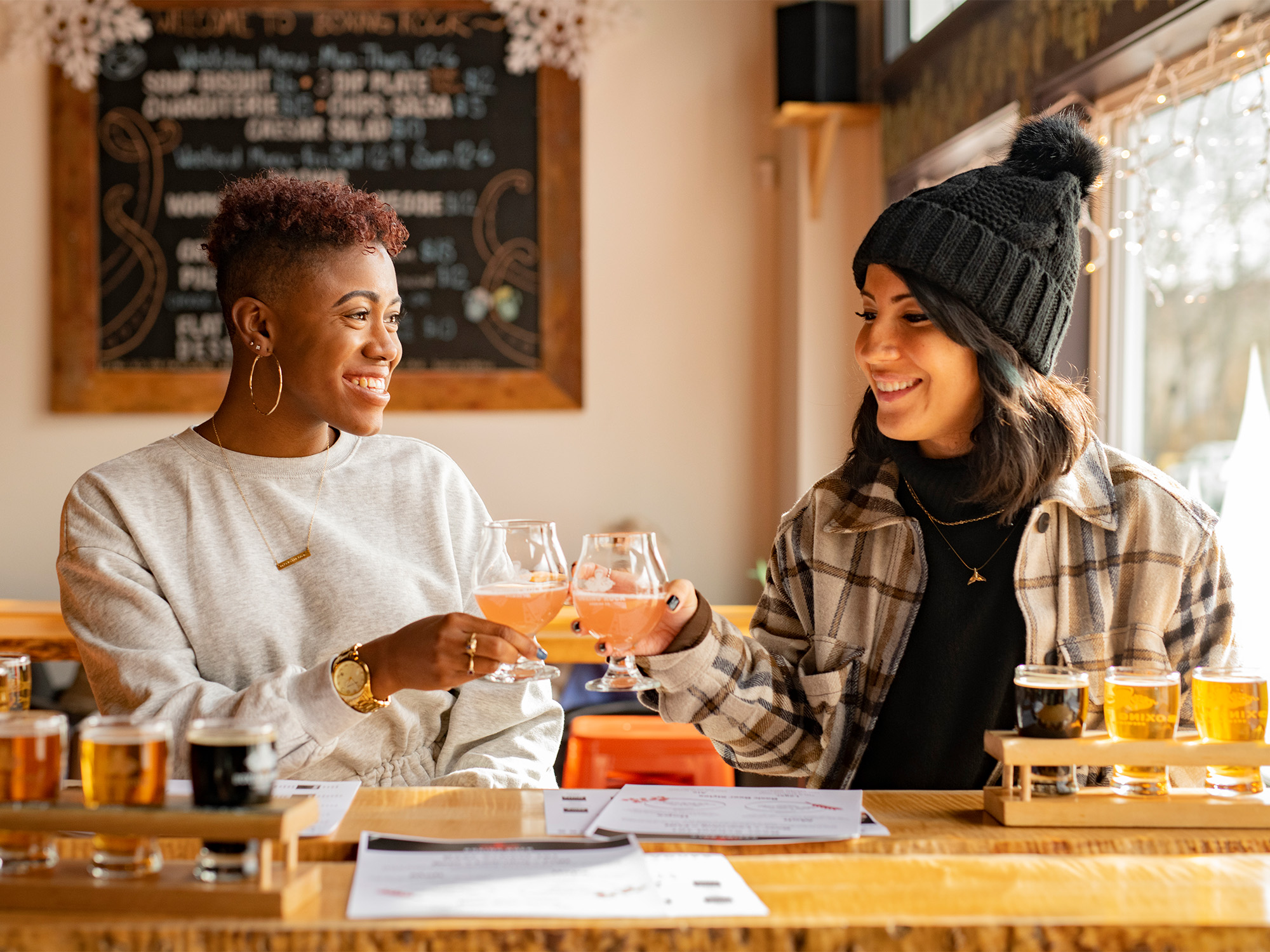 Two people cheersing at Boxing Rock Brewery