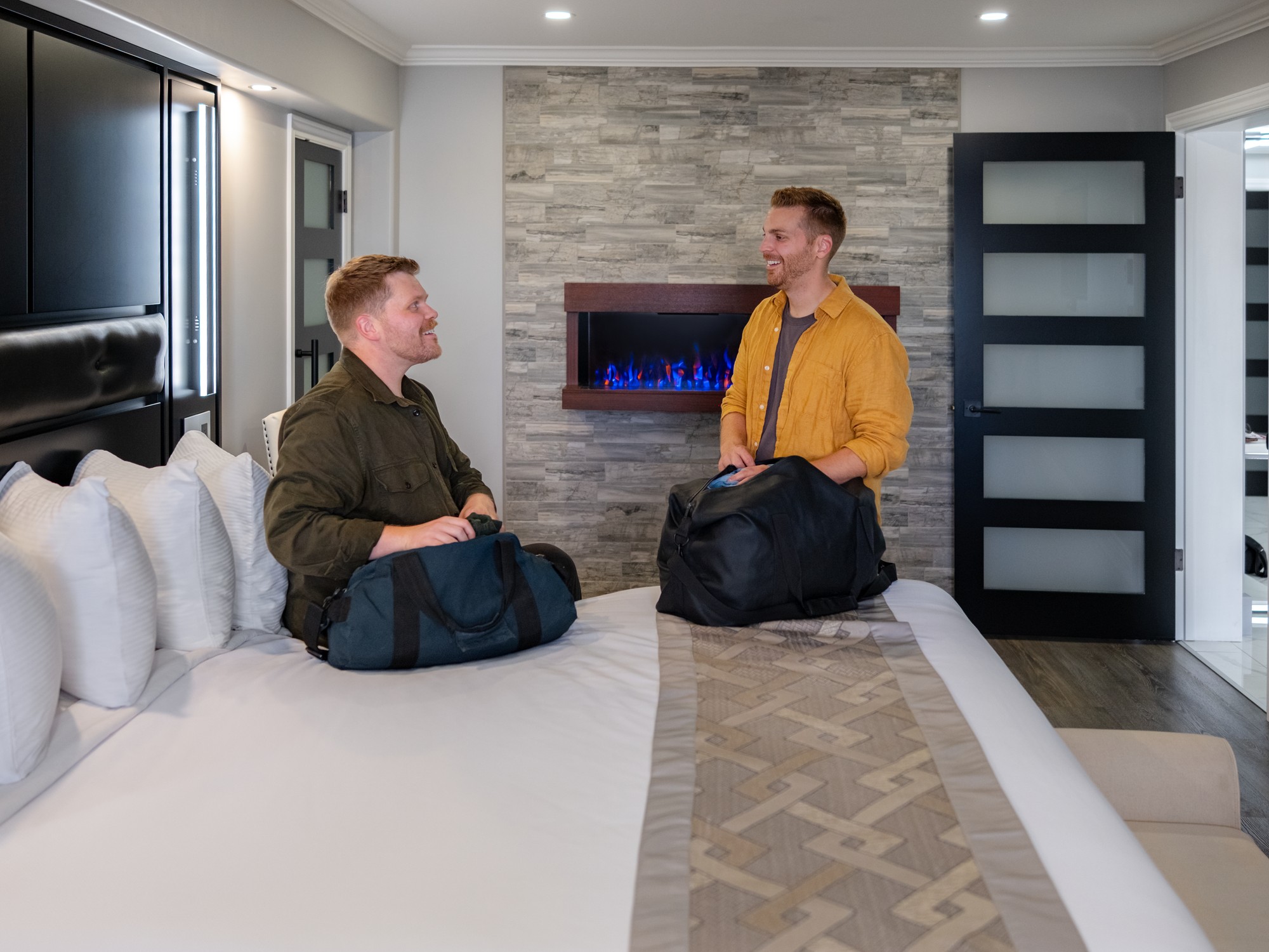 Two people are in a guest room at the Dockside Suites in Digby, Nova Scotia