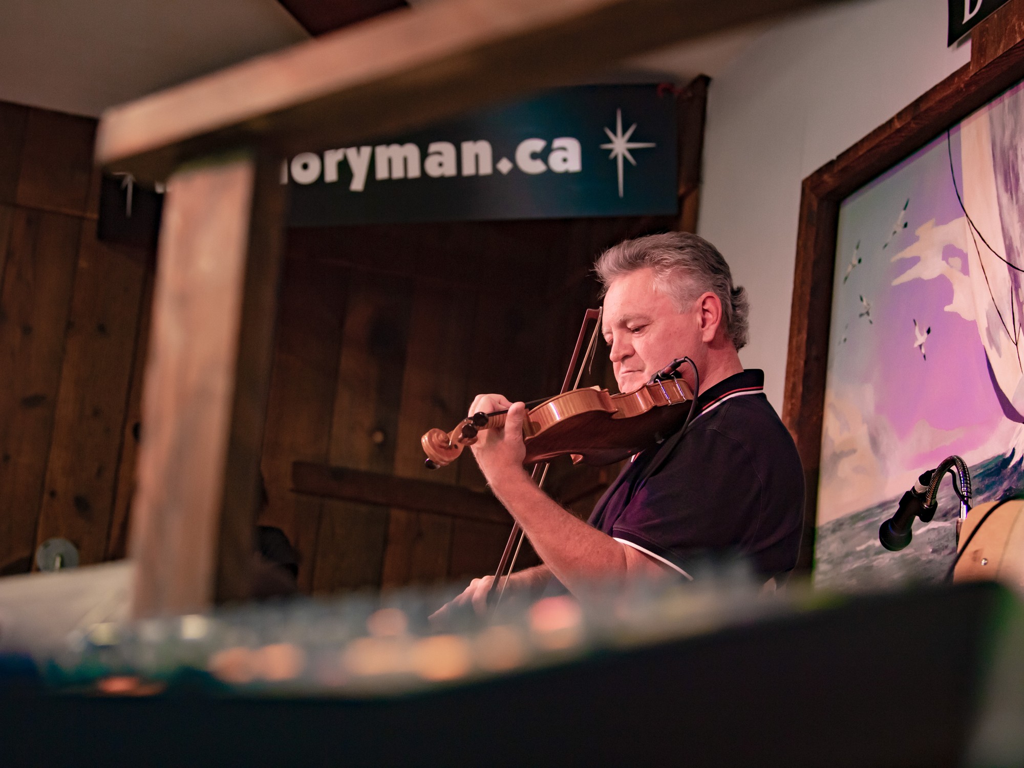 A fiddler performs at the Doryman Pub in Cheticamp, Nova Scotia