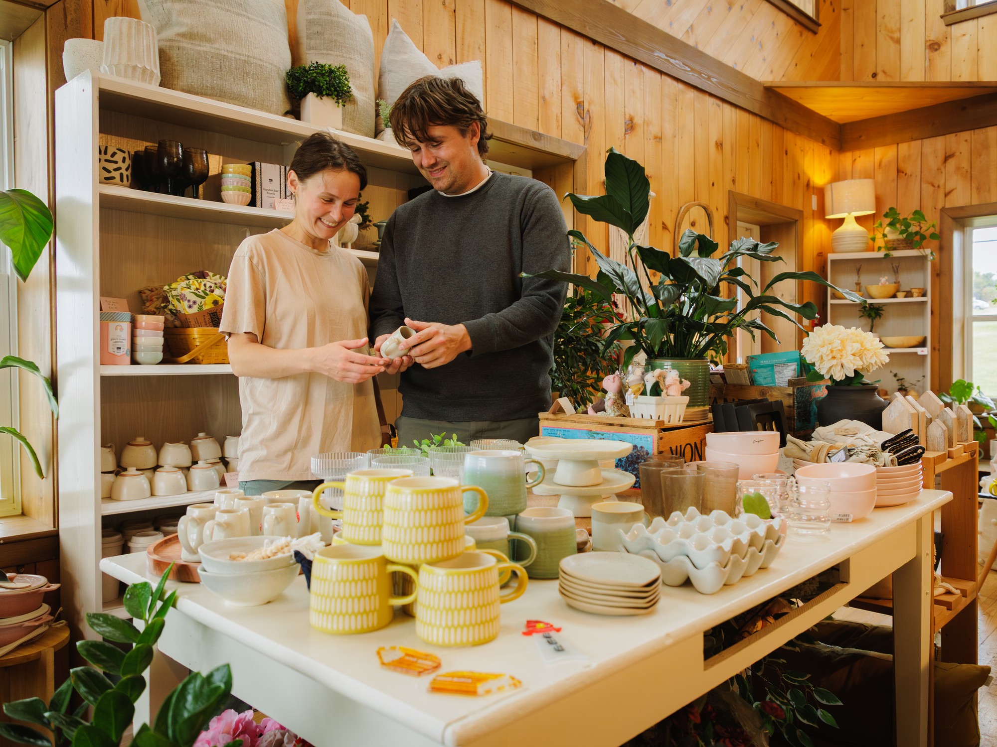 Two people browse for items in a boutique in Cheticamp, Nova Scotia