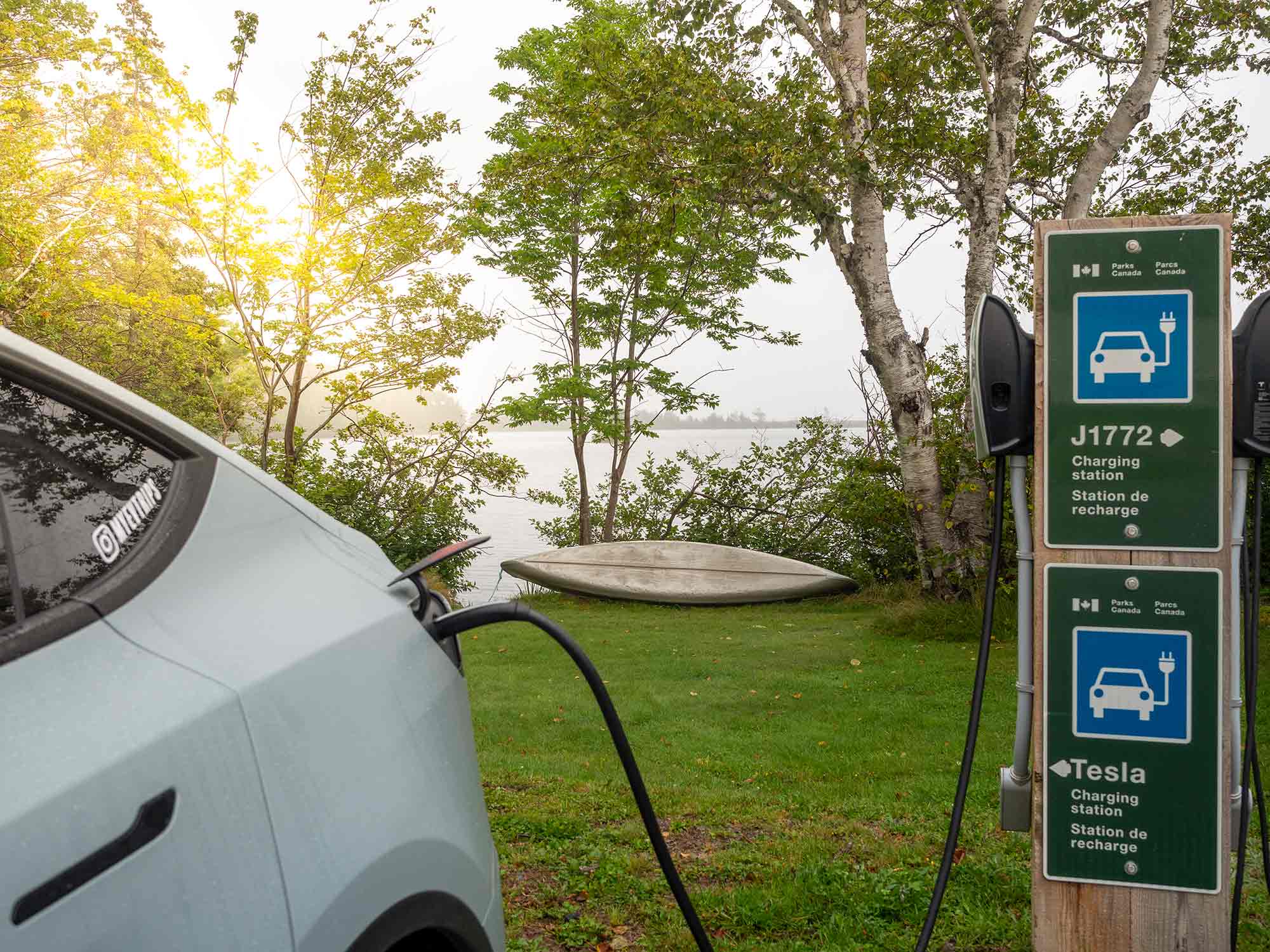 Electric car charging at an EV car charge station located within one of the Parks Canada sites in Nova Scotia.