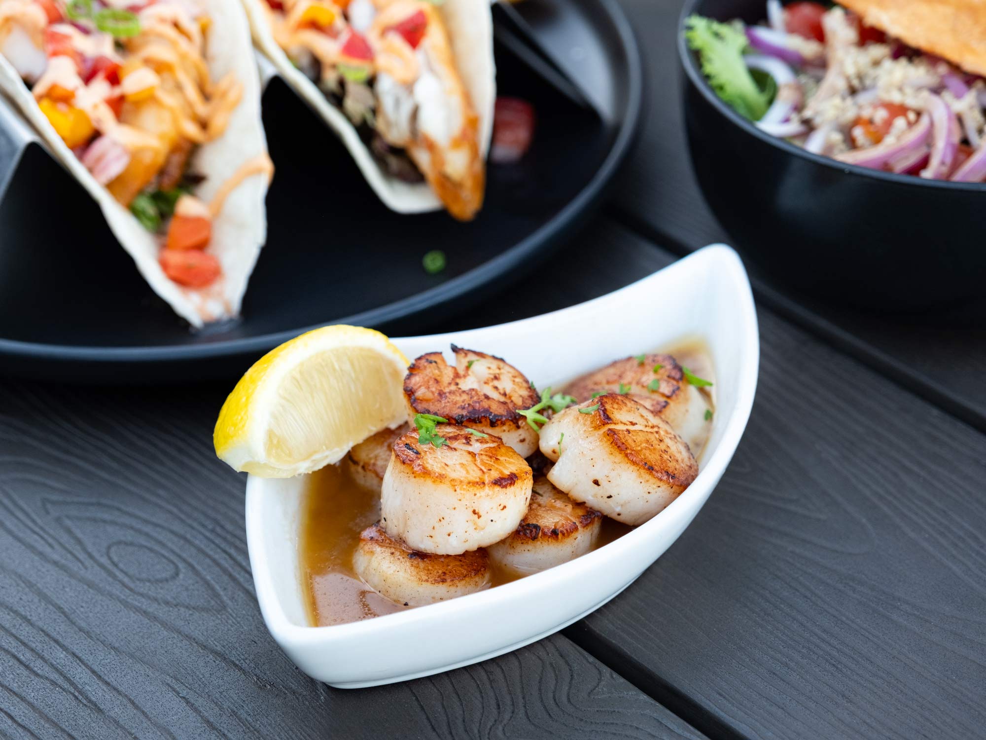 Photo of perfectly pan-seared Digby scallops in apple butter, served at a restaurant in Digby, Nova Scotia, the Digby Capital of the World.