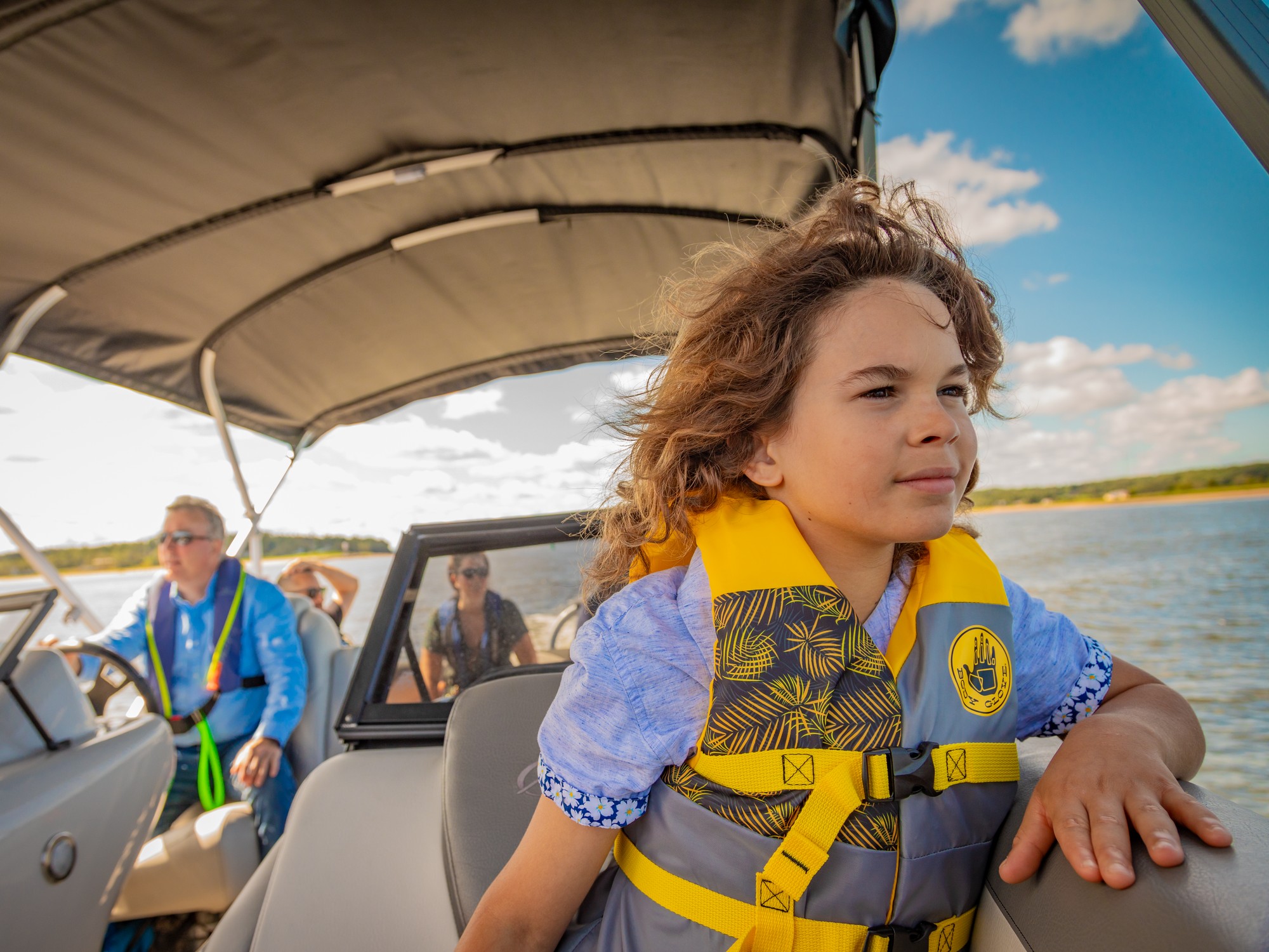 A kid looks out at the water during a boat tour in Pictou, Nova Scotia