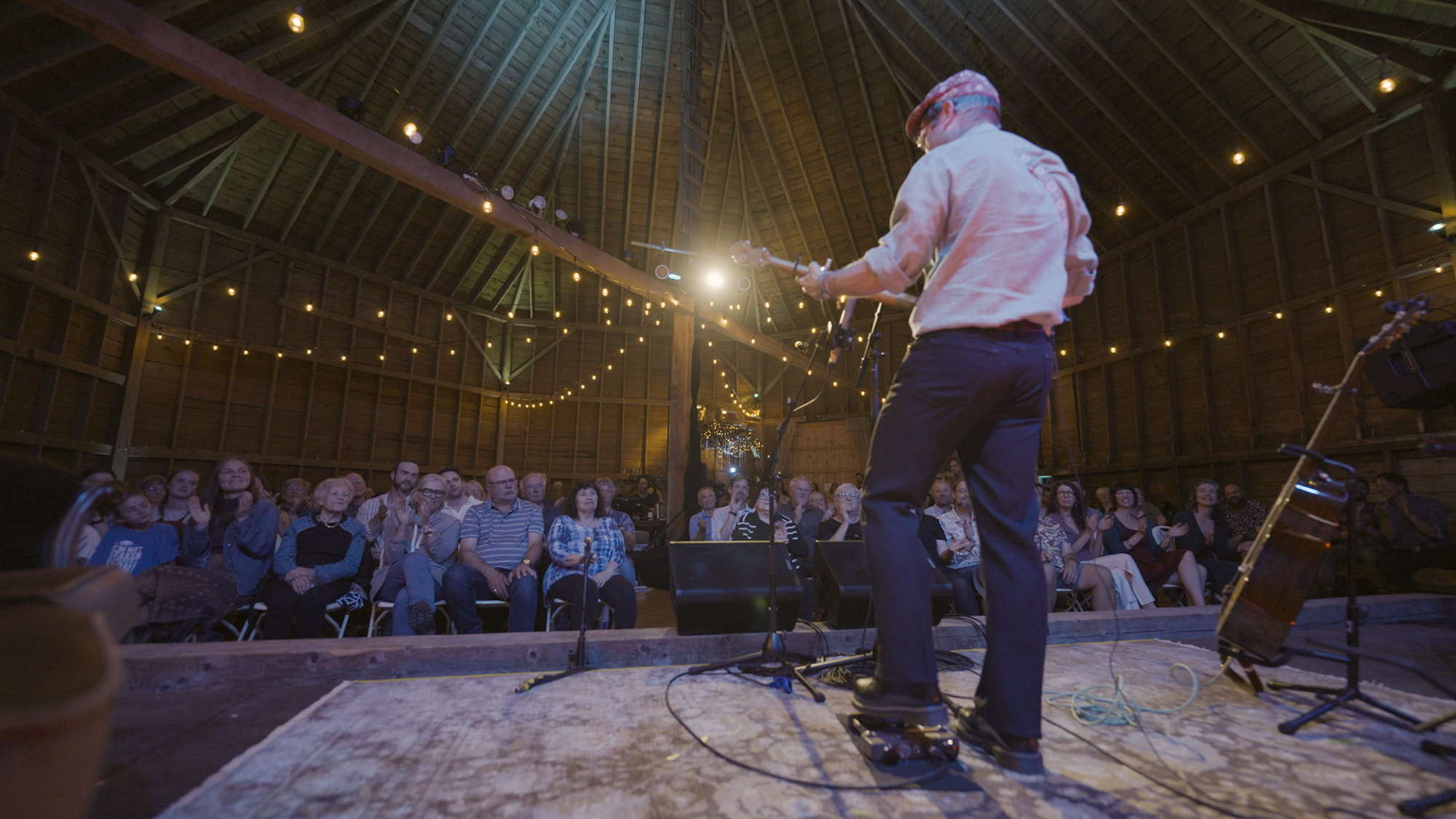 A performer plays guitar and sings at The Round Barn near Truro, Nova Scotia