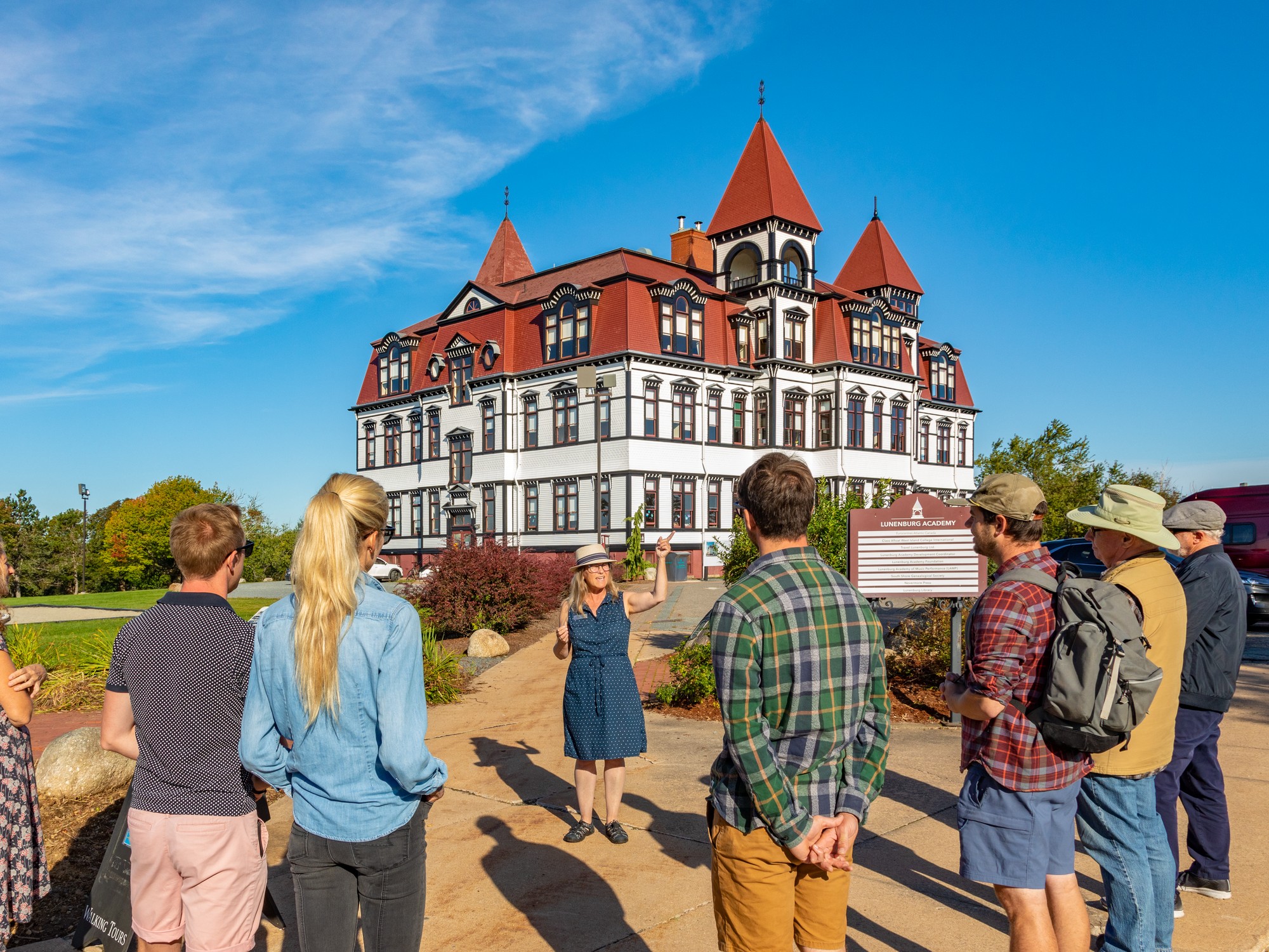 A tour group listens to a guide during Lunenburg Walking Tours in Nova Scotia