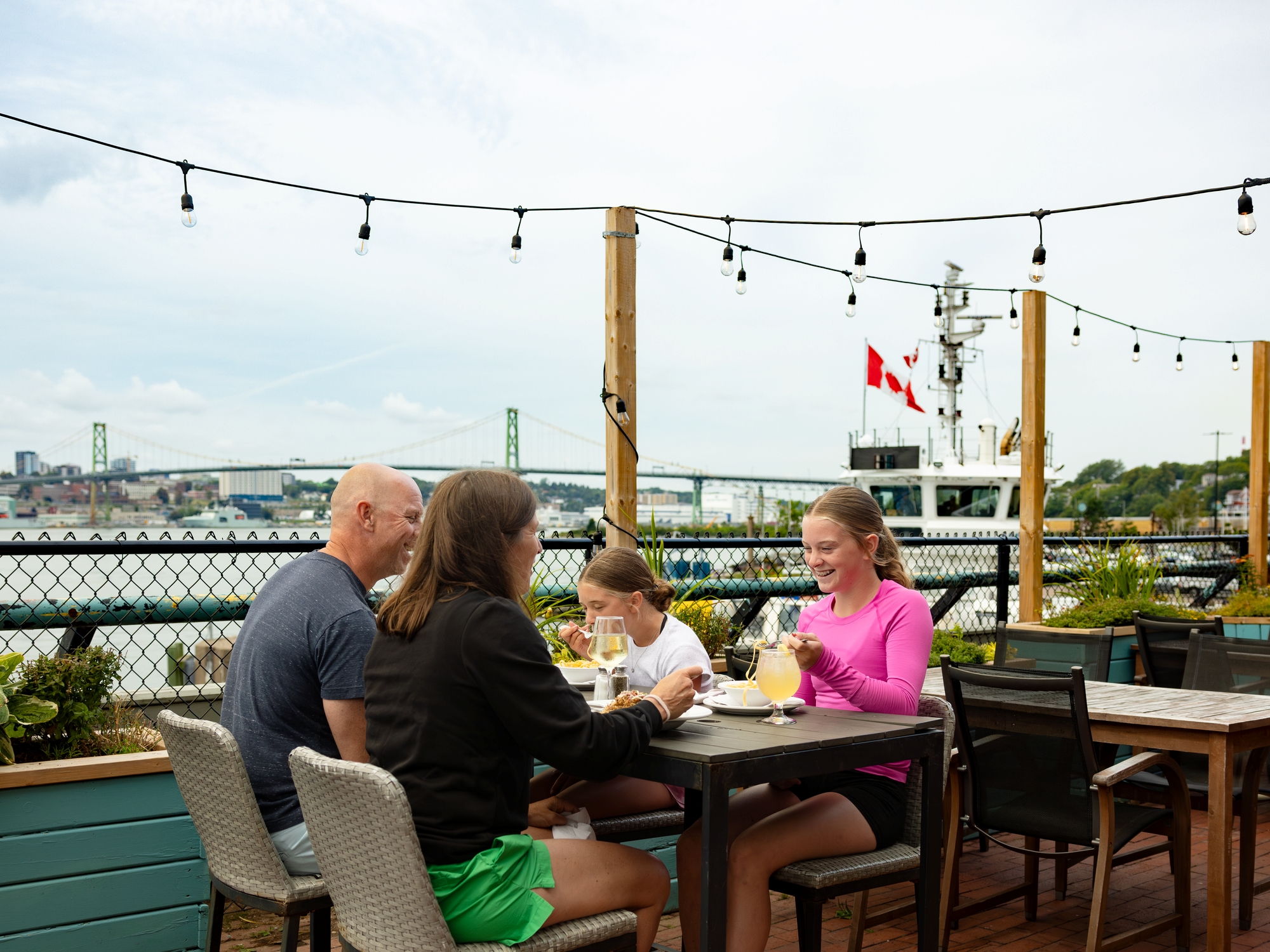 Family enjoying a meal on a patio