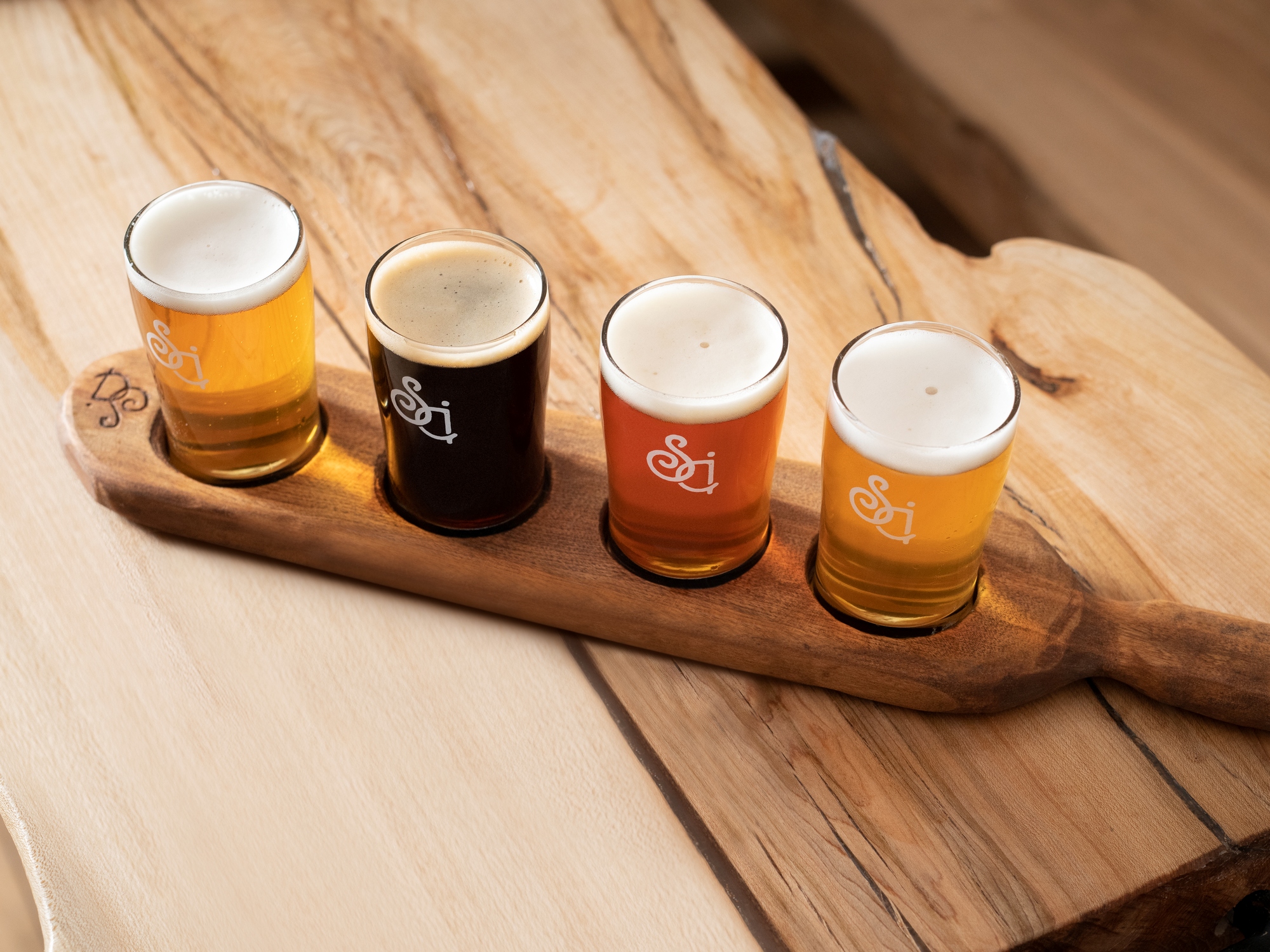 Flight of beer on a wooden table