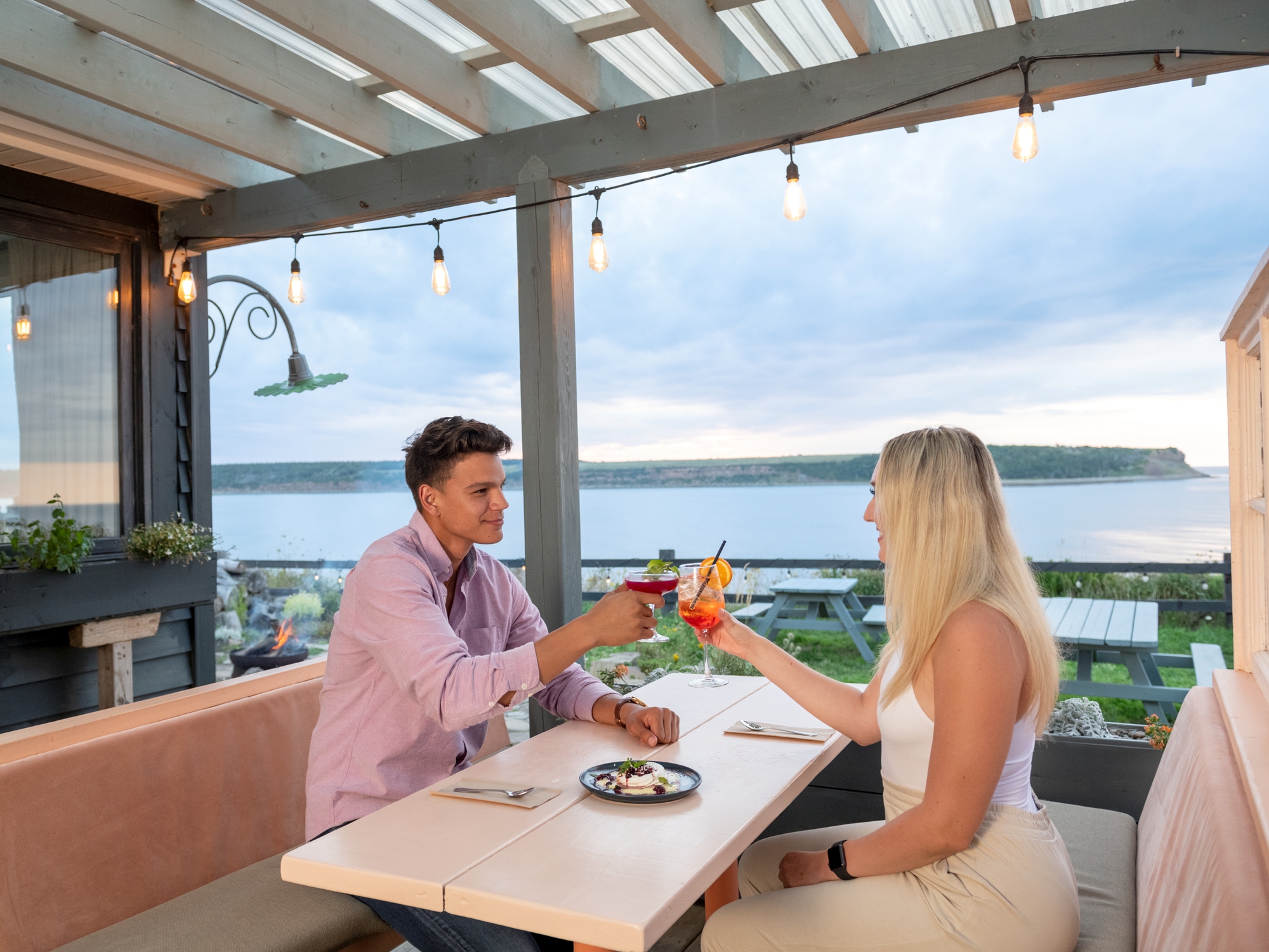 People at a patio overlooking the water