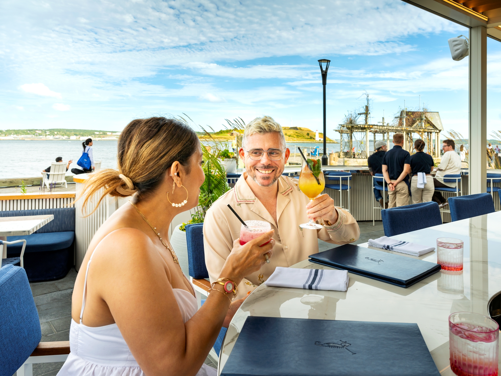 Couple enjoying beverages on a patio
