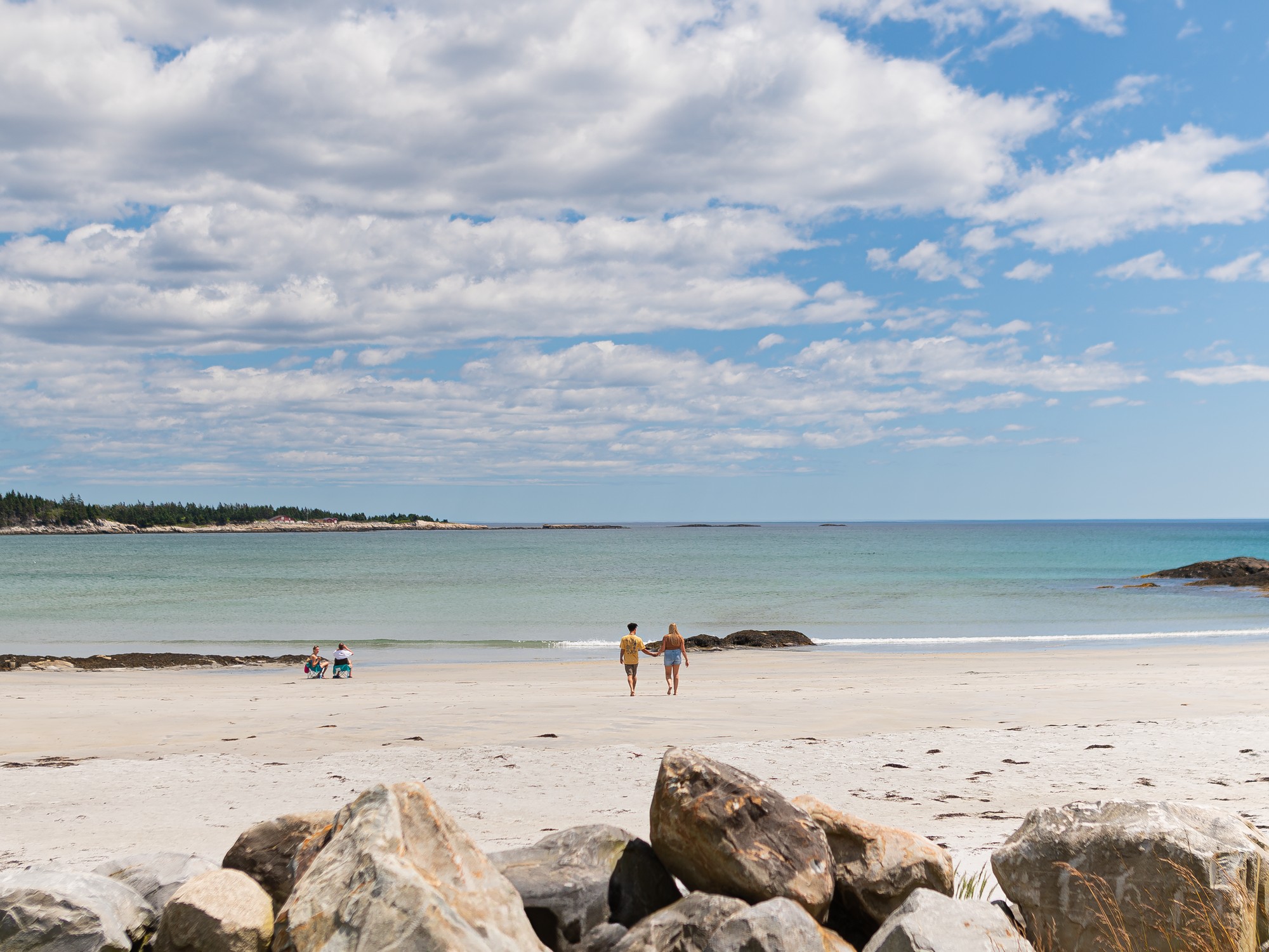 White sand Crescent Beach in Lockeport, Nova Scotia on a blue sky day.