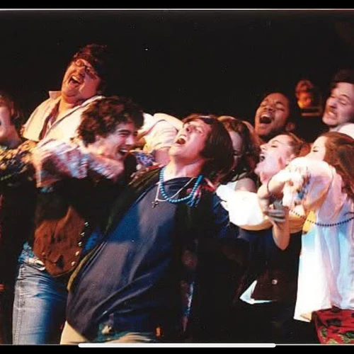 People stand on stage in a production
