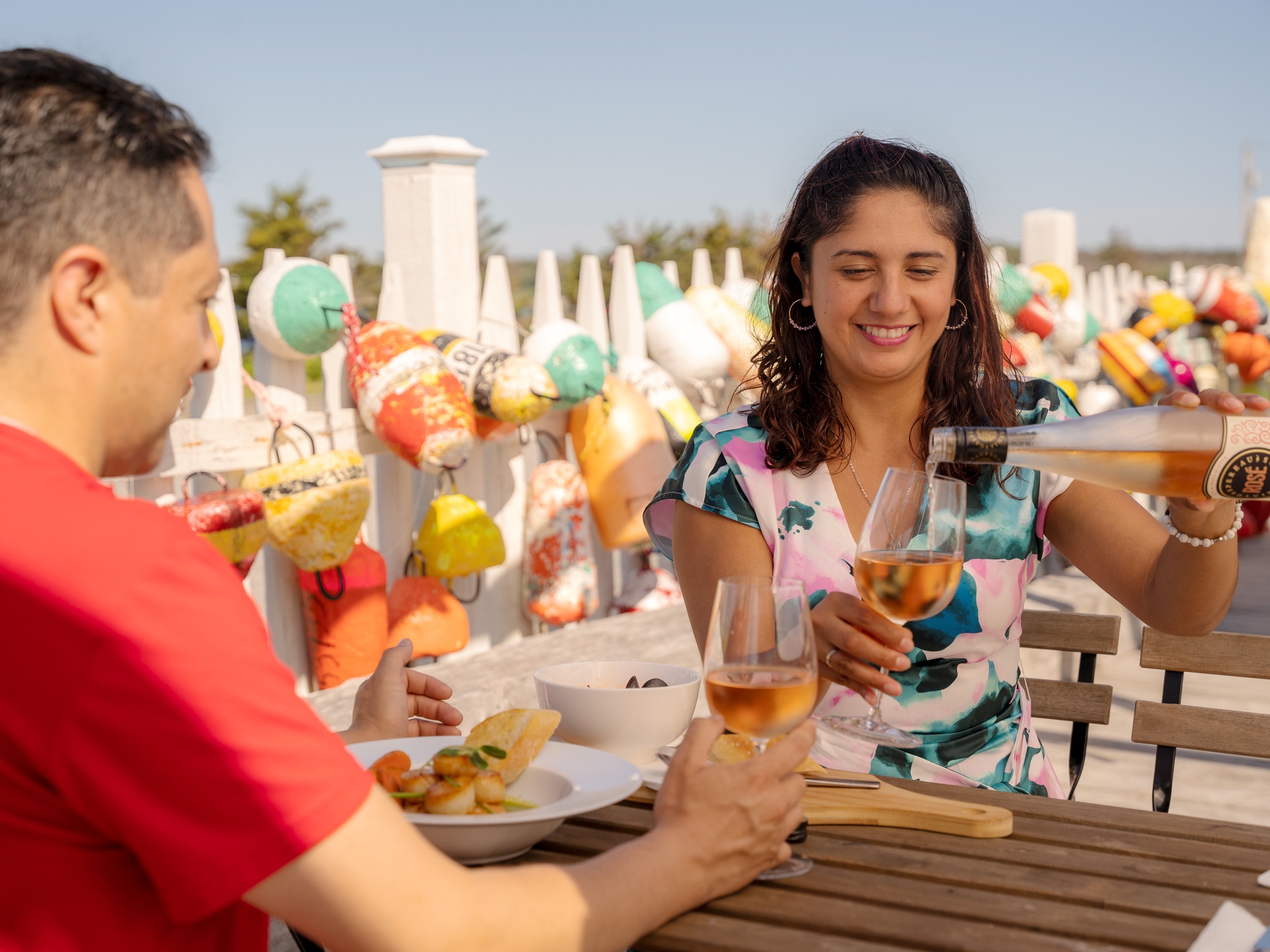People enjoying wine on a patio