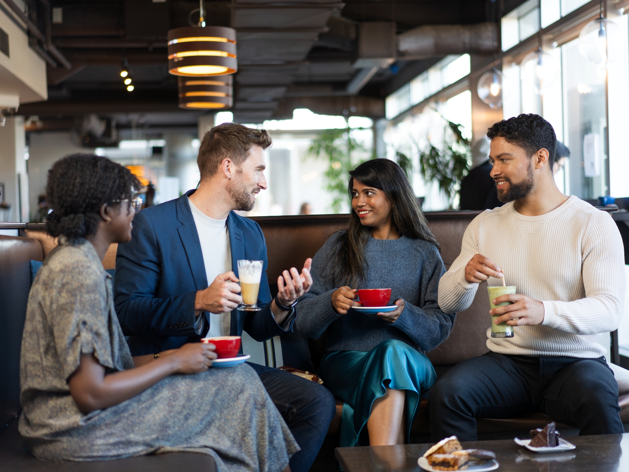 Group of friends having coffee at a cafe