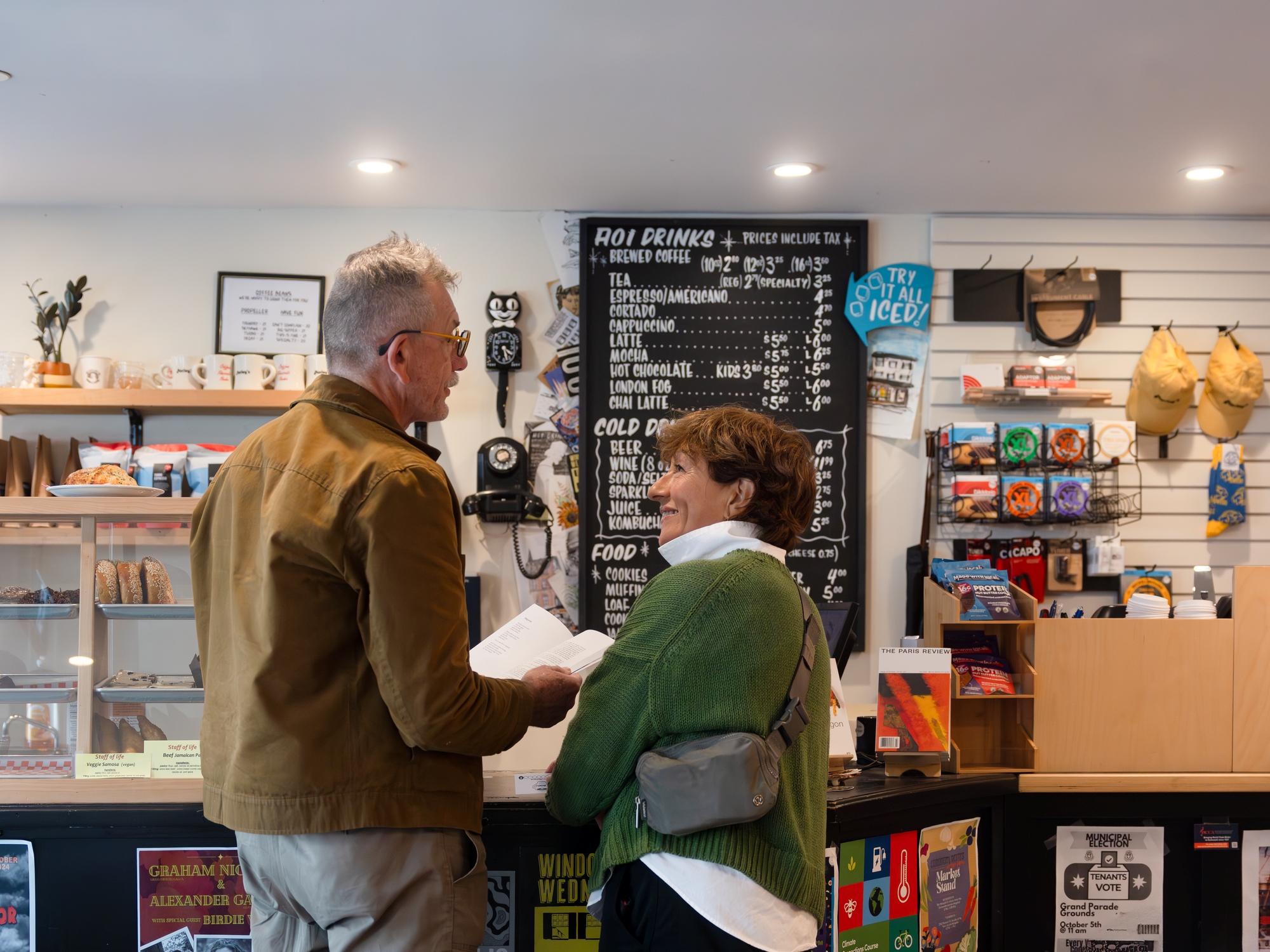 Couple standing at a coffee shop counter