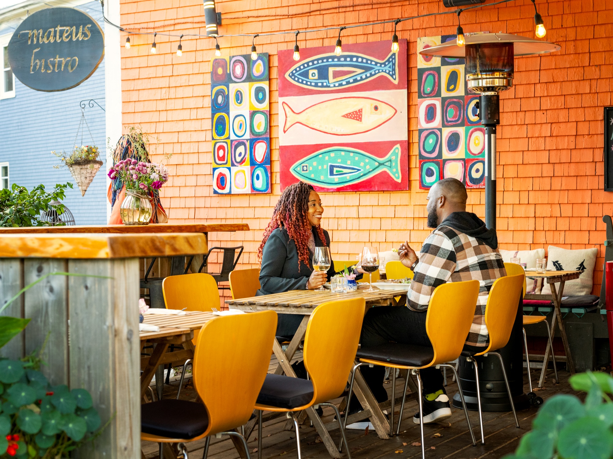 People on a brightly coloured patio