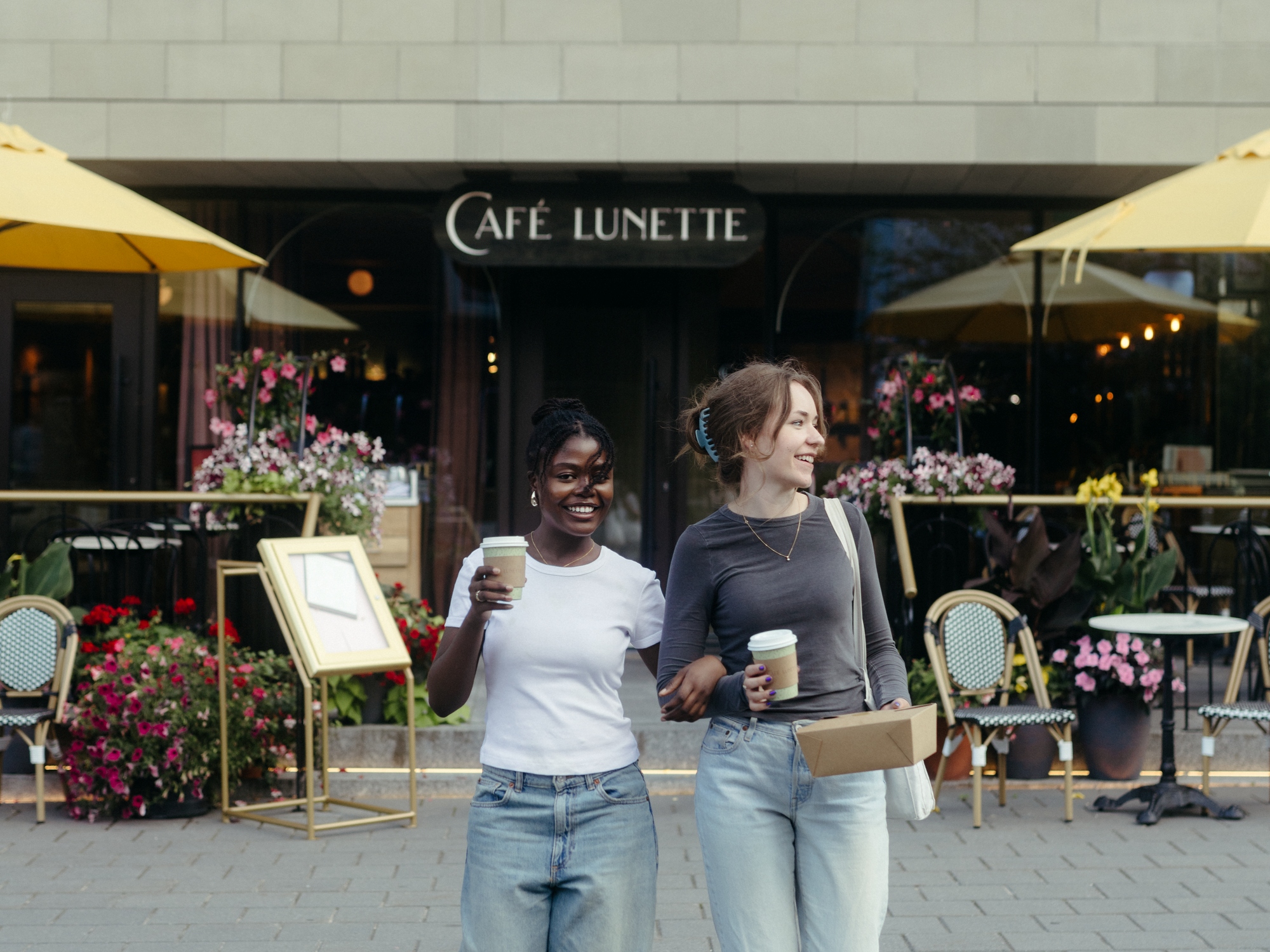 People heading out of a cafe