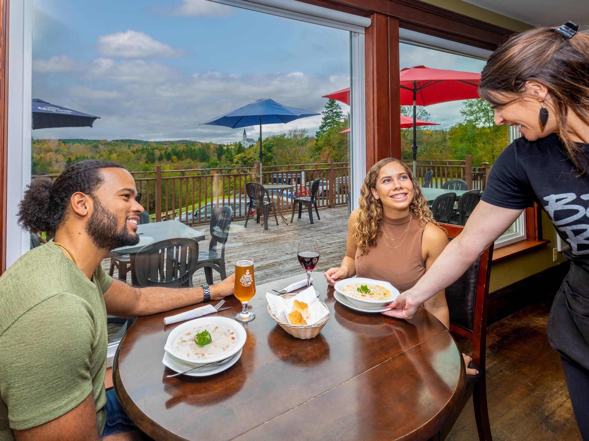 People dining with the view of a patio outside