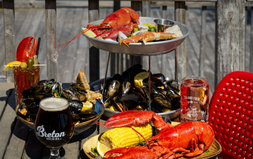 Various plated seafood dishes featuring lobster, mussels and more from Sip & Shuck at Inverary Resort in Nova Scotia