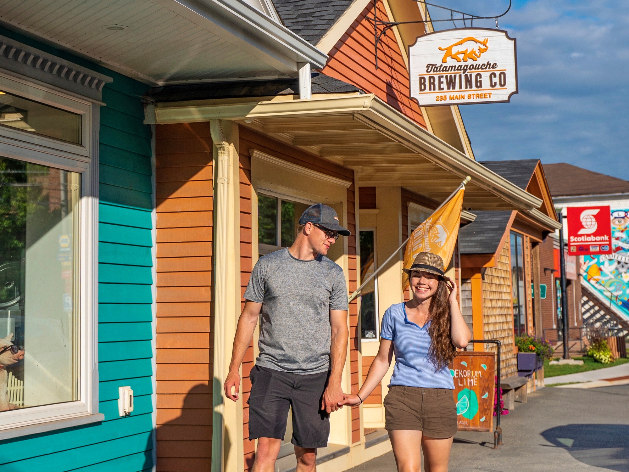 Couple walking outside of Tatamagouche brewing company