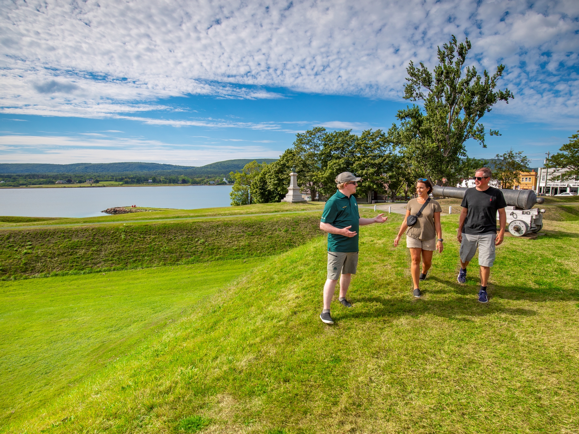 Couple at historic site with Parks Canada Interpreter