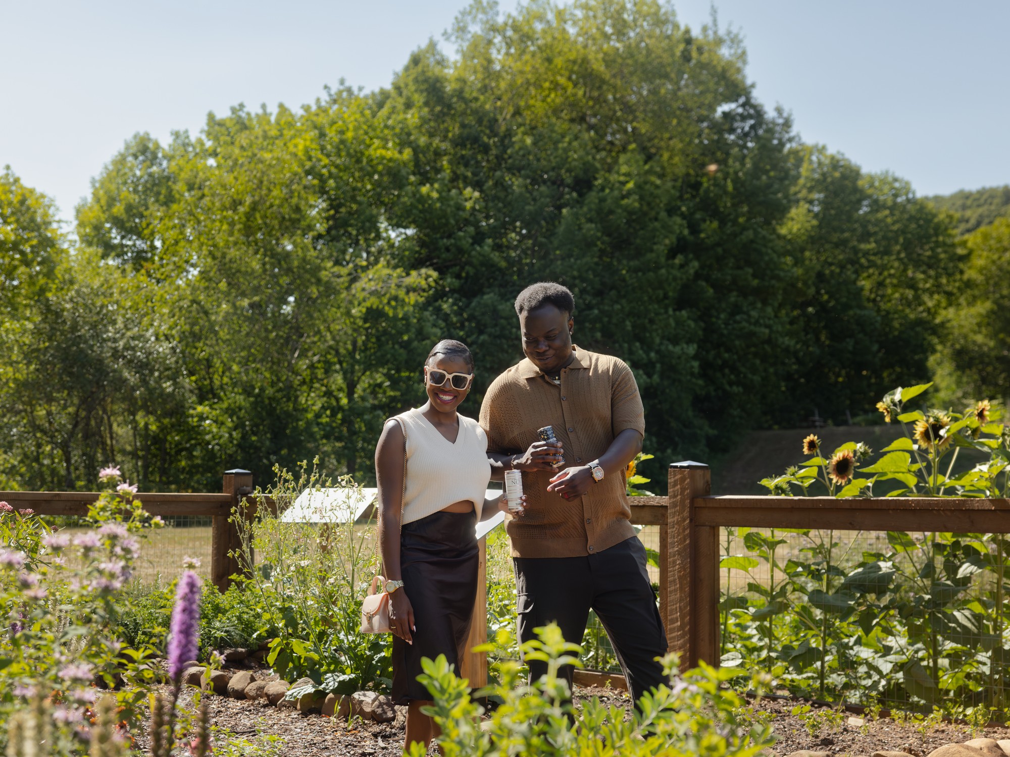 two people explore the garden at Benjamin Bridg Vineyards in Nova Scotia