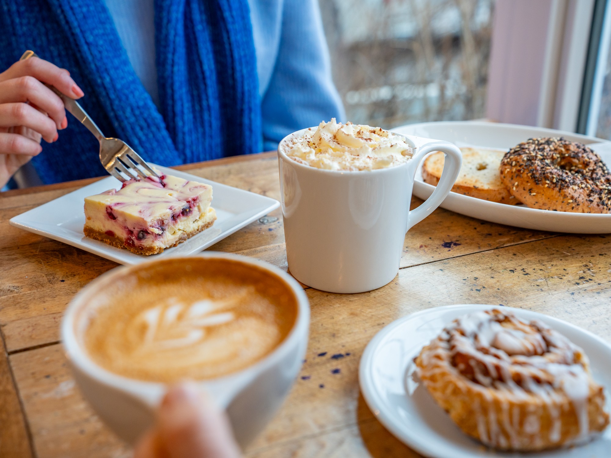 A table of sweets and coffees at Just Us Cafe near Wolfville, Nova Scotia